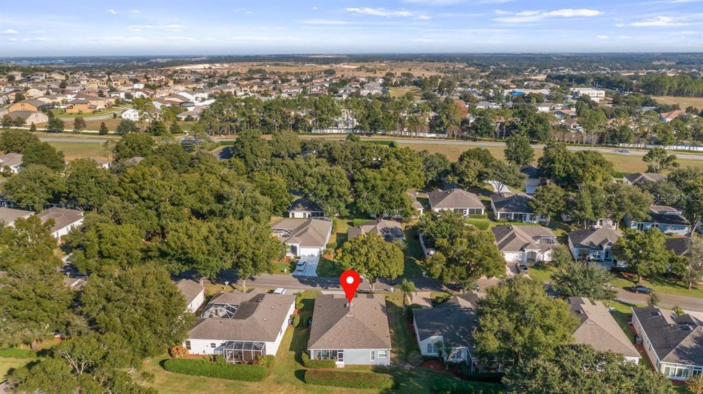 4232 Newland Street Clermont, FL 34711 - Photo 37 of 45 an aerial view of residential houses with outdoor space and trees
