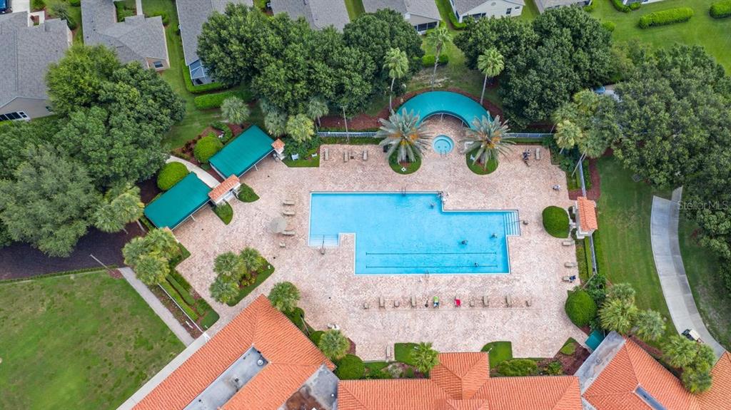 4232 Newland Street Clermont, FL 34711 - Photo 40 of 45 an aerial view of a house with a swimming pool patio and outdoor seating