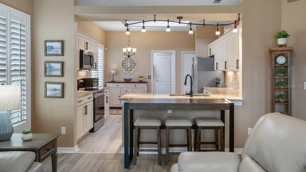 4232 Newland Street Clermont, FL 34711 - Photo 6 of 45 a bathroom with a sink a mirror and a chair