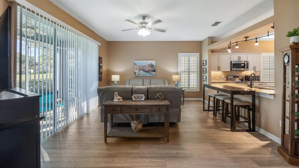 4232 Newland Street Clermont, FL 34711 - Photo 9 of 45 a living room with furniture and a table