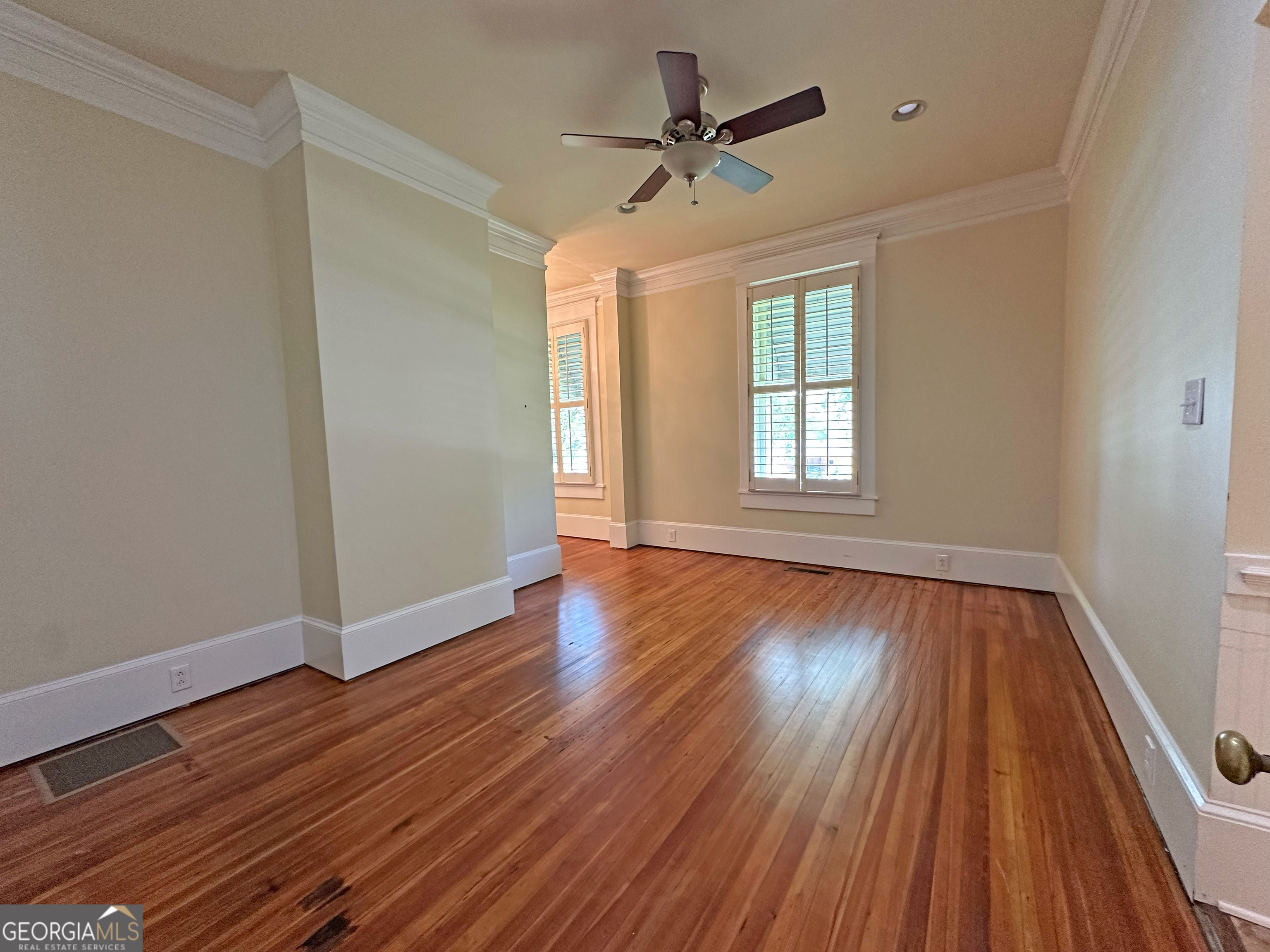 1010 Oglethorpe Avenue Athens, GA 30606 - Photo 15 of 28 a view of empty room with wooden floor and fan
