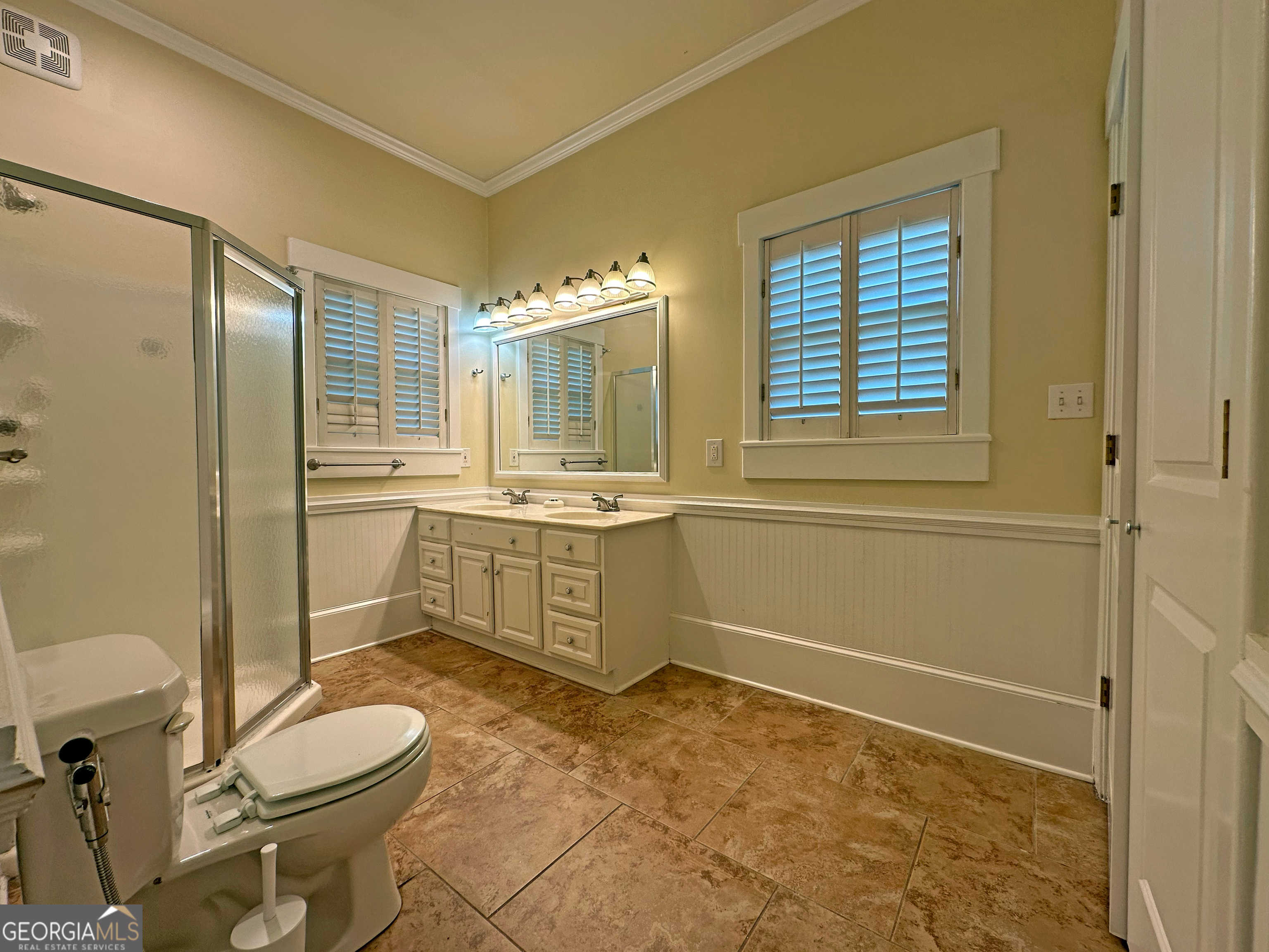1010 Oglethorpe Avenue Athens, GA 30606 - Photo 16 of 28 a bathroom with a sink toilet and shower