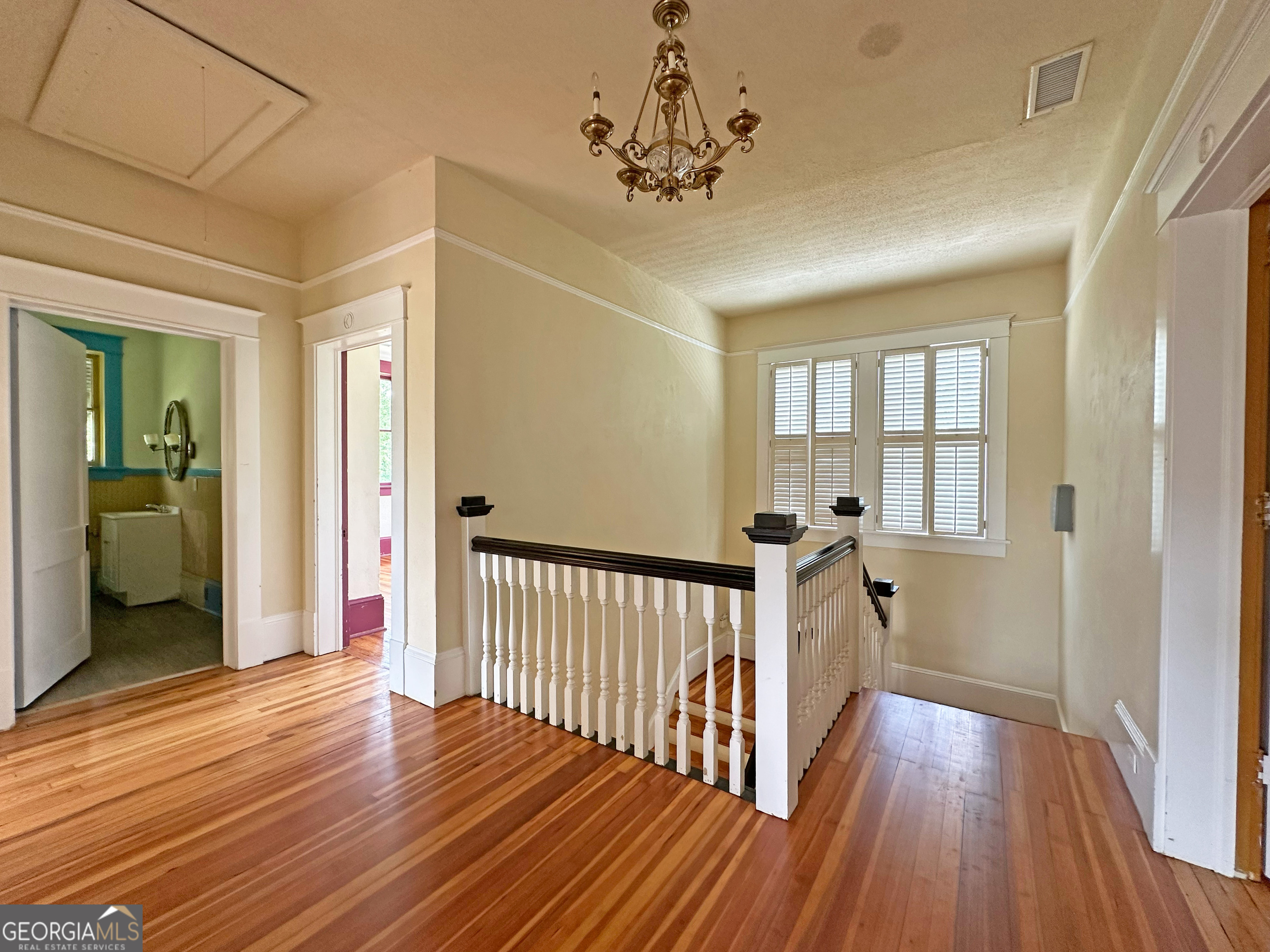 1010 Oglethorpe Avenue Athens, GA 30606 - Photo 20 of 28 a view of a hallway view with wooden floor and staircase