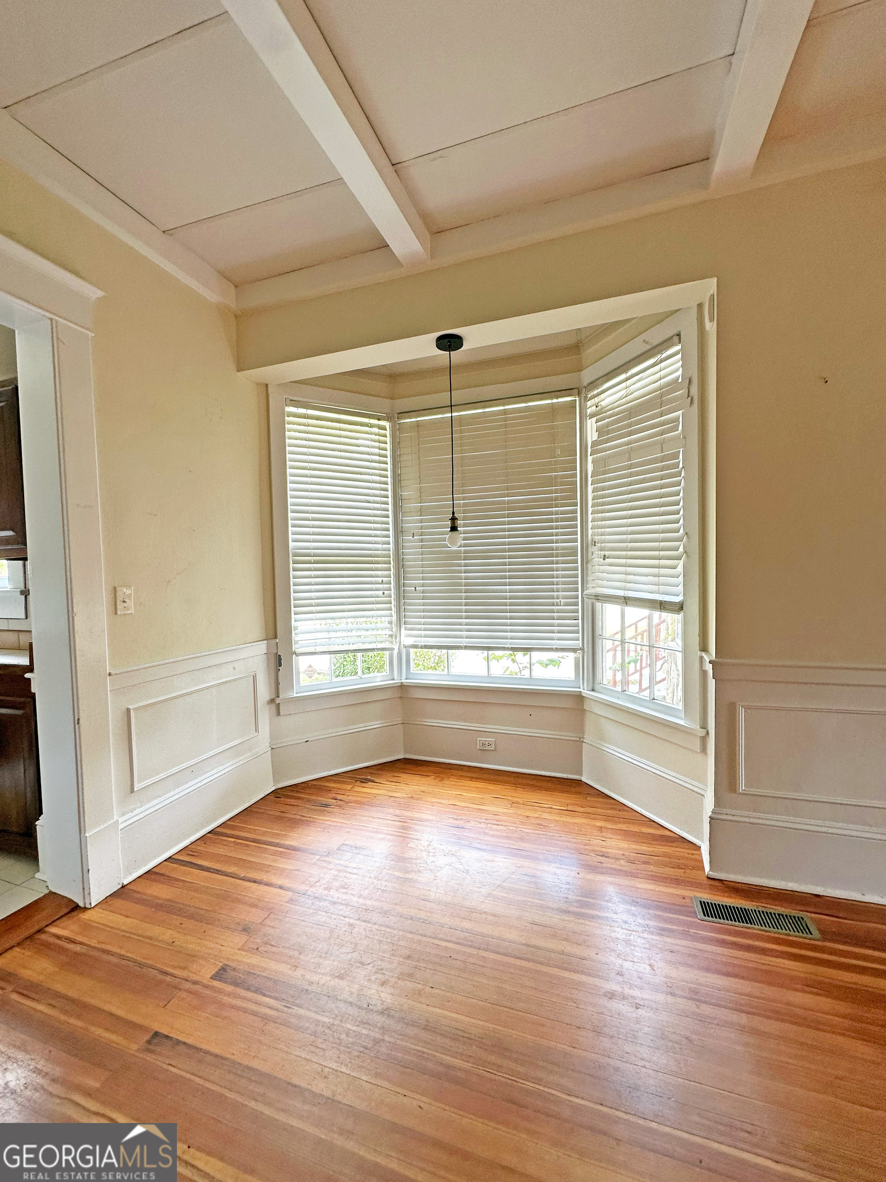 1010 Oglethorpe Avenue Athens, GA 30606 - Photo 10 of 28 a view of a room with wooden floor and windows