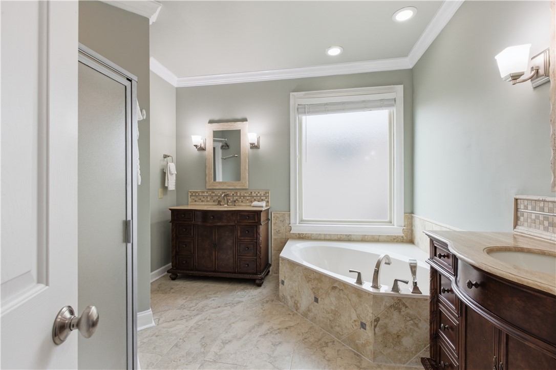 501 Capri Point Lavonia, GA 30553 - Photo 28 of 50 This serene bathroom offers a soaking tub and elegant vanity, perfect for unwinding.