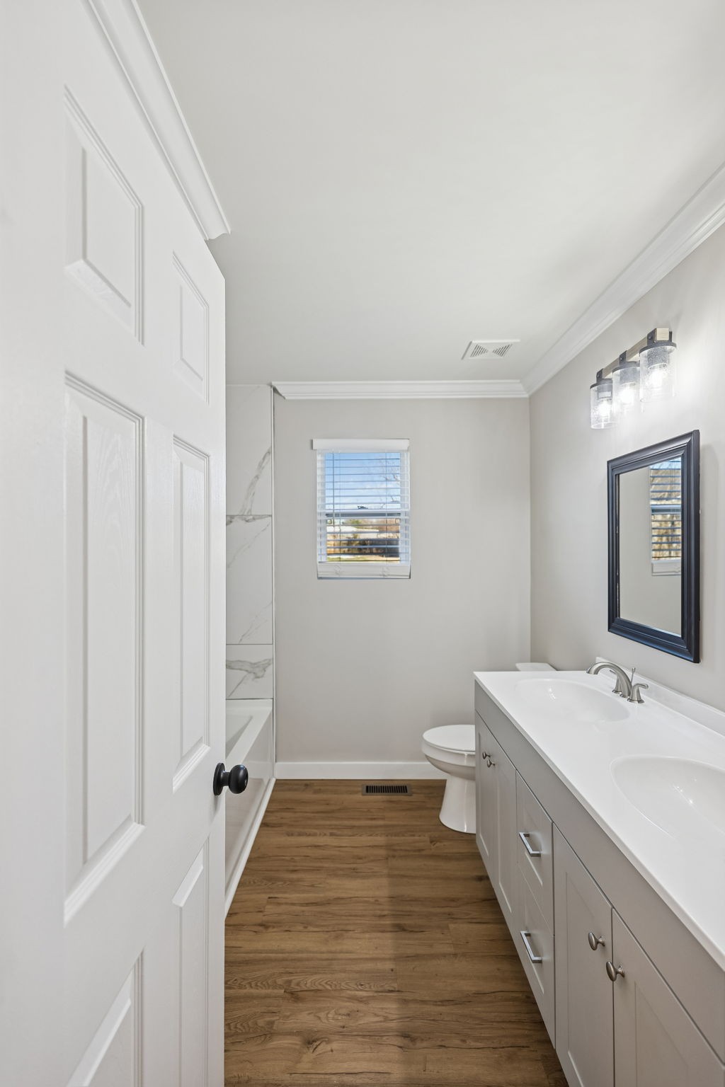 3770 Penile Hill Road Decherd, TN 37324 - Photo 18 of 32 a spacious bathroom with a double vanity sink and a mirror