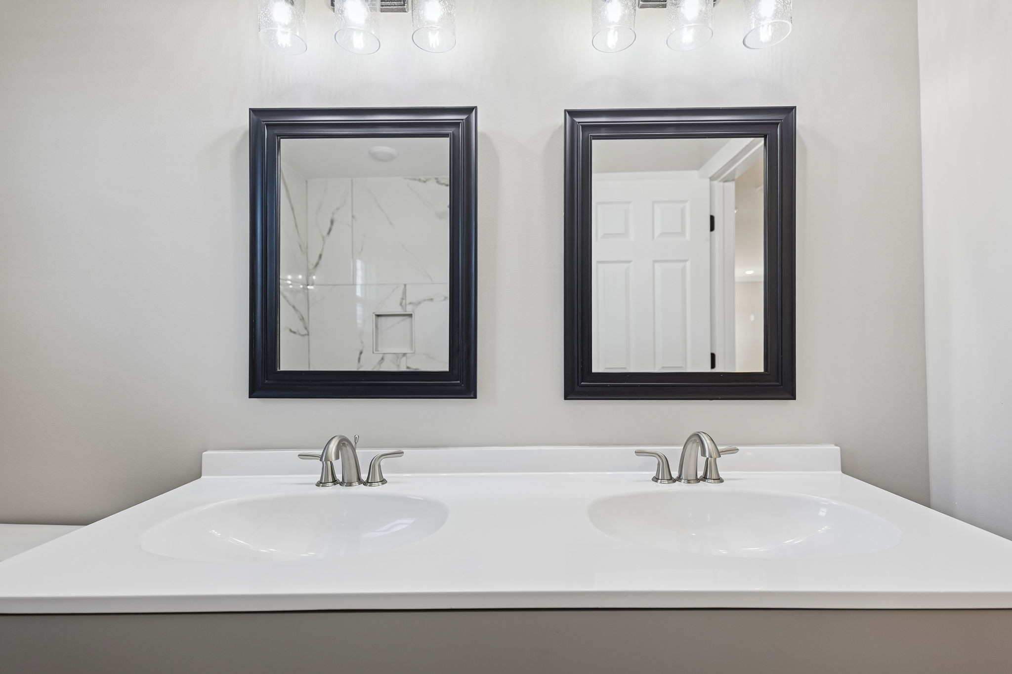 3770 Penile Hill Road Decherd, TN 37324 - Photo 19 of 32 a bathroom with double vanity sinks and a mirror