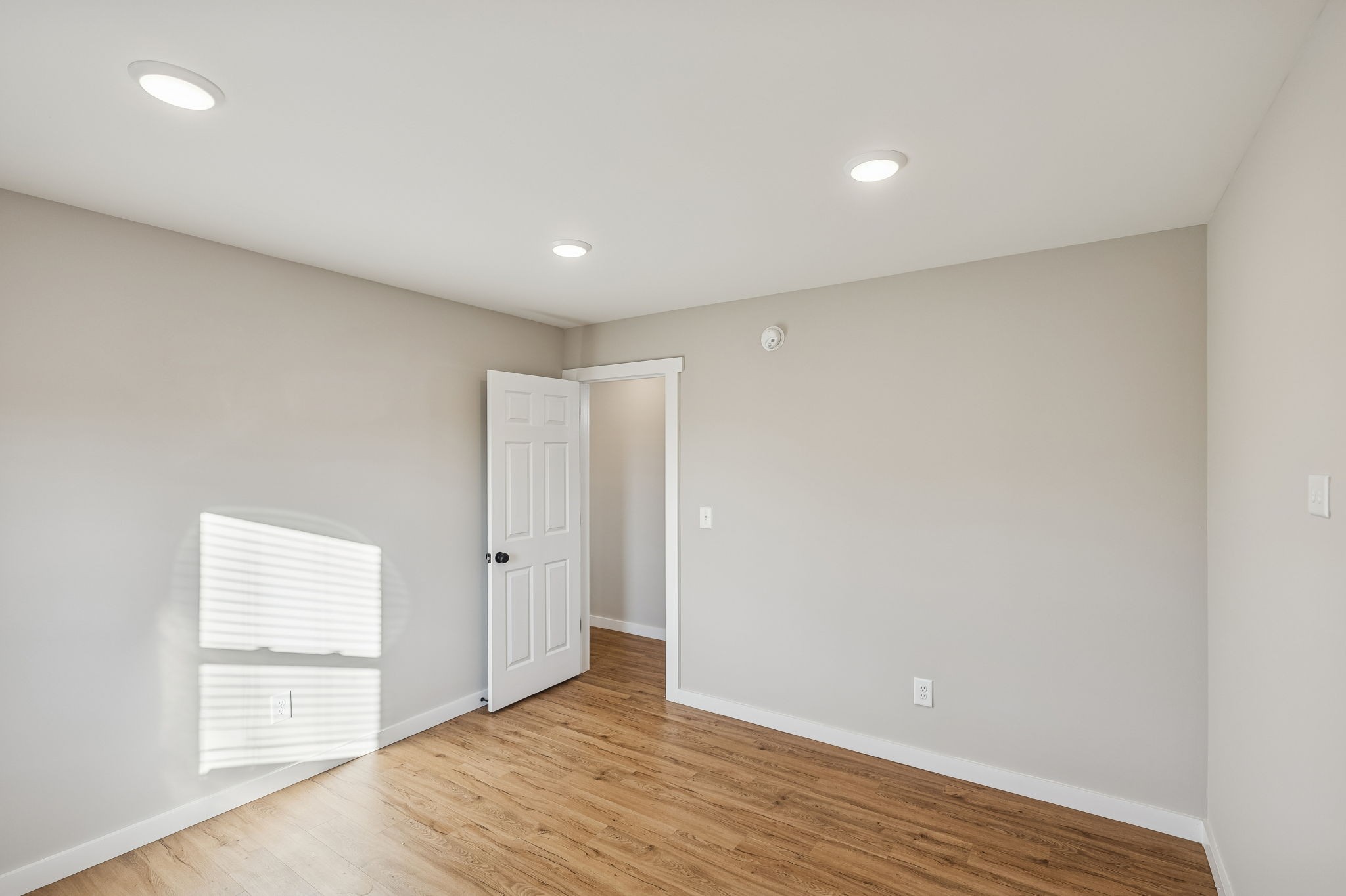 3770 Penile Hill Road Decherd, TN 37324 - Photo 22 of 32 an empty room with wooden floor & windows