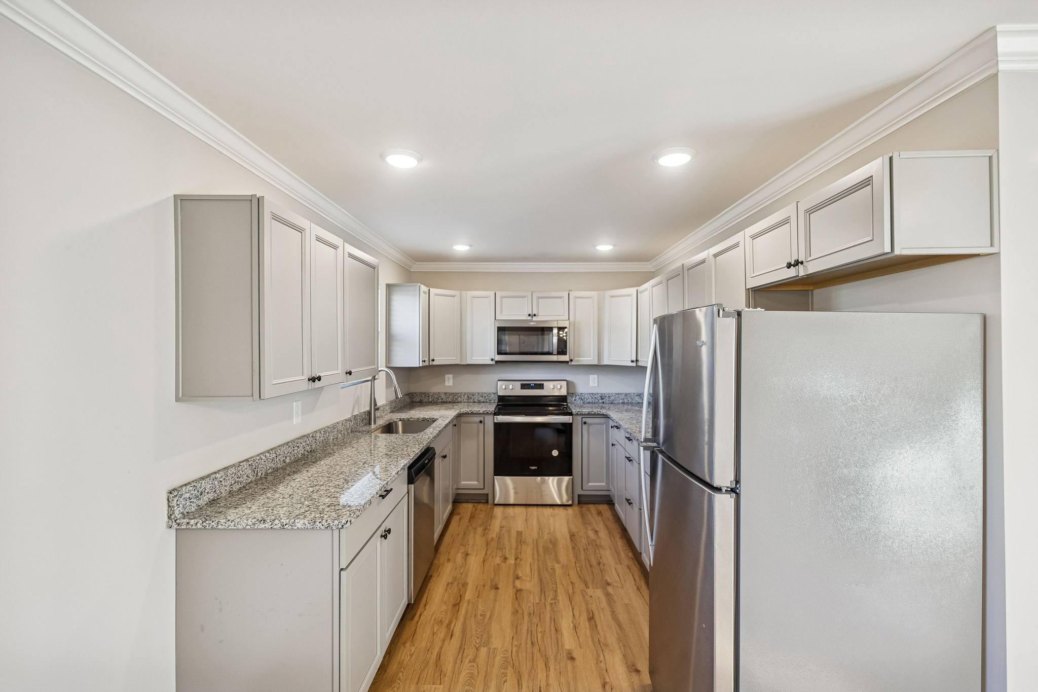 3770 Penile Hill Road Decherd, TN 37324 - Photo 6 of 32 a kitchen with stainless steel appliances granite countertop a refrigerator and a stove top oven