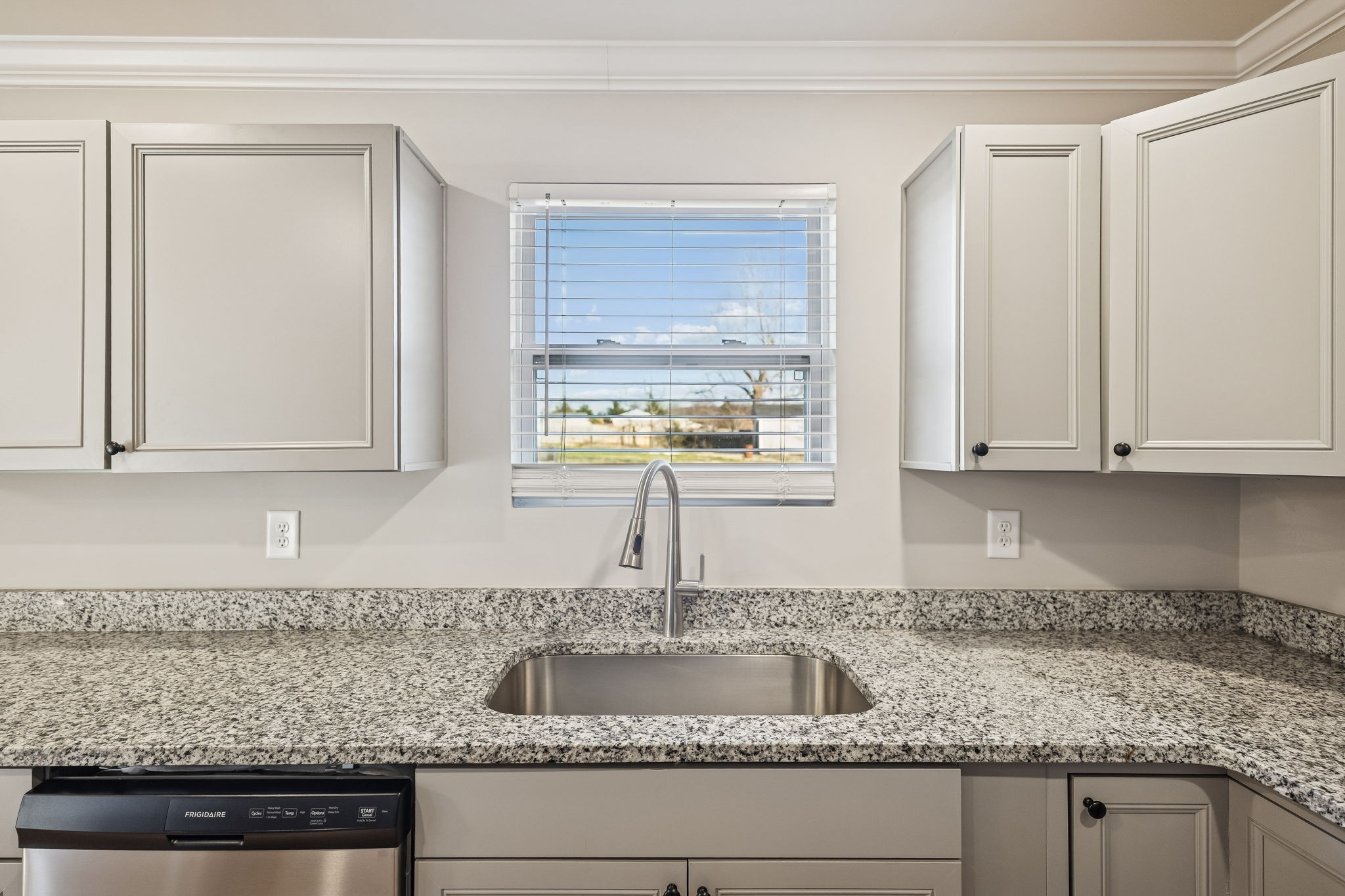 3770 Penile Hill Road Decherd, TN 37324 - Photo 8 of 32 a kitchen with granite countertop a sink window and cabinets