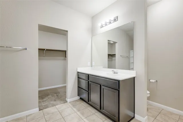 a bathroom with a glass shower door