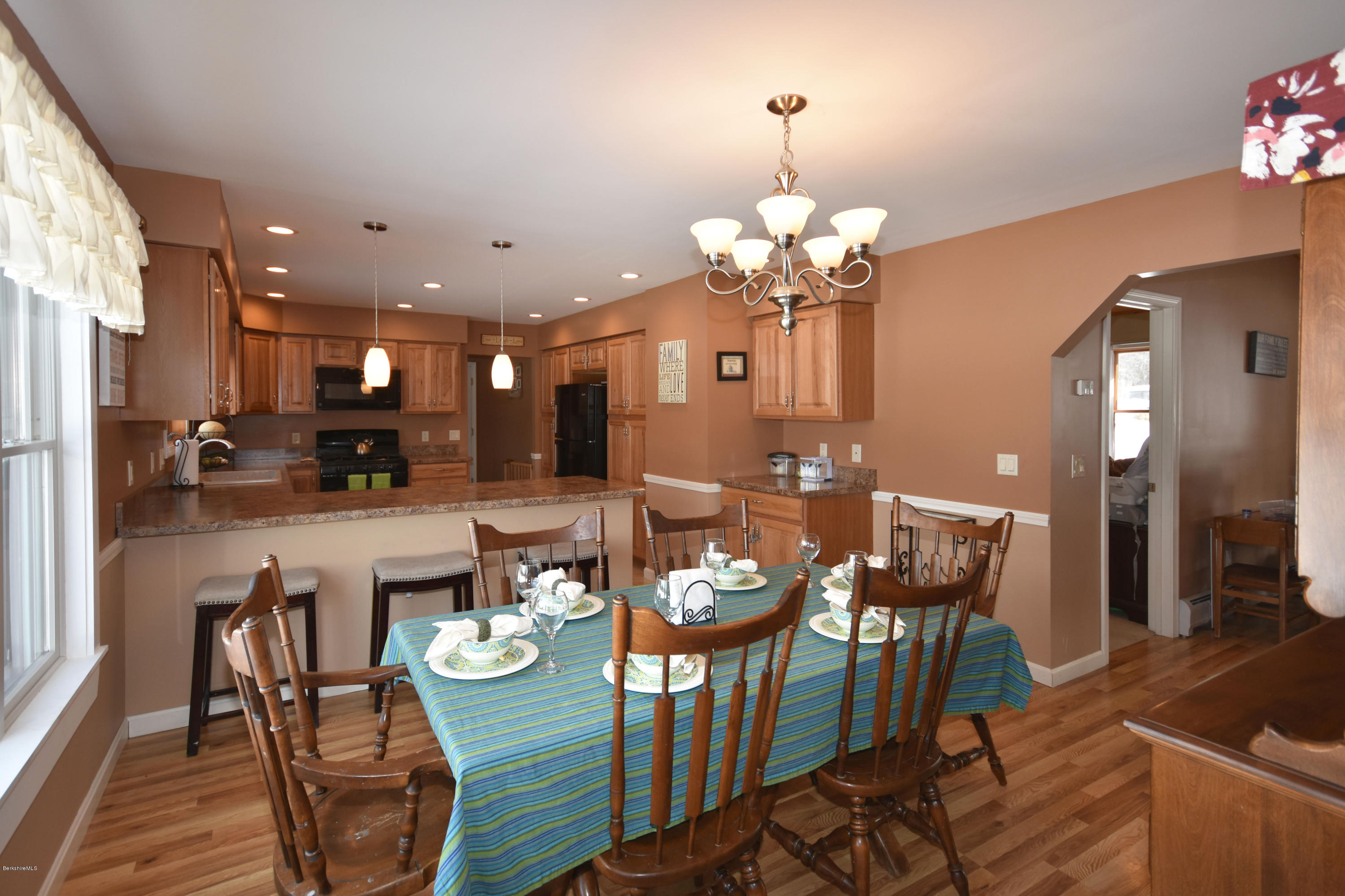 215 Windsor Road Savoy, MA 01256 - Photo 11 of 55 a view of a dining room with furniture and wooden floor