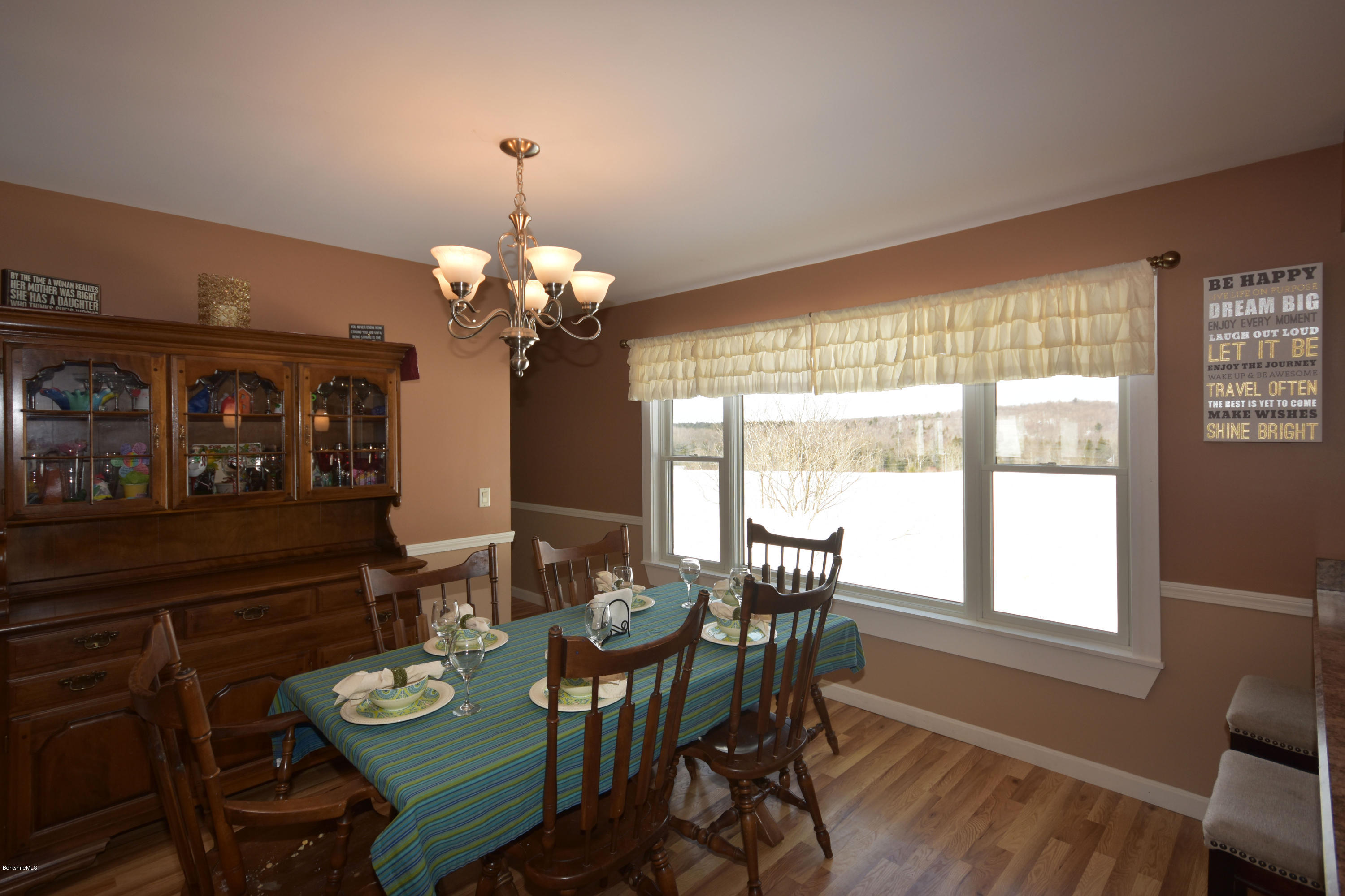 215 Windsor Road Savoy, MA 01256 - Photo 13 of 55 a view of a dining room with furniture a chandelier and wooden floor