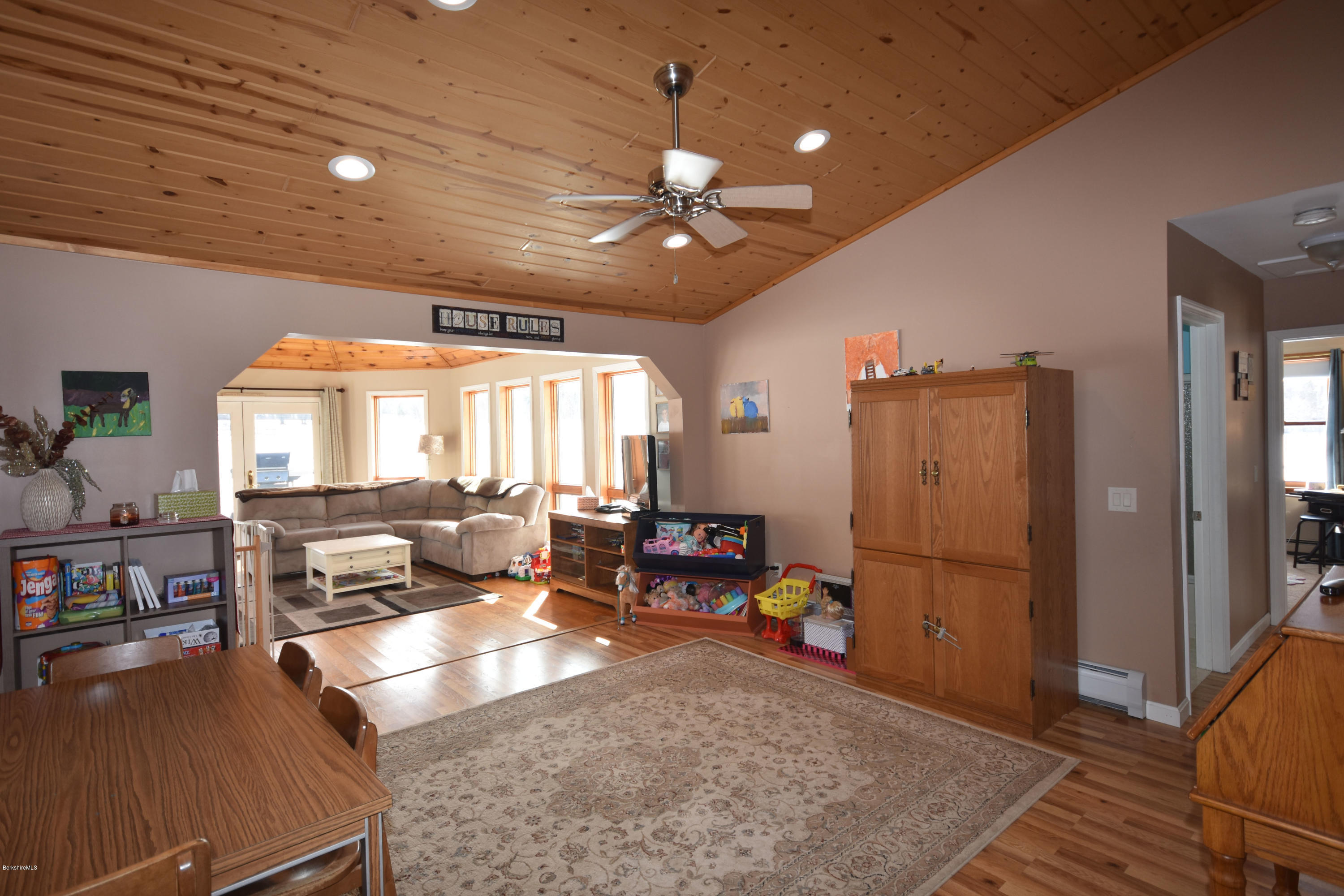 215 Windsor Road Savoy, MA 01256 - Photo 14 of 55 a living room with furniture a flat screen tv and a table