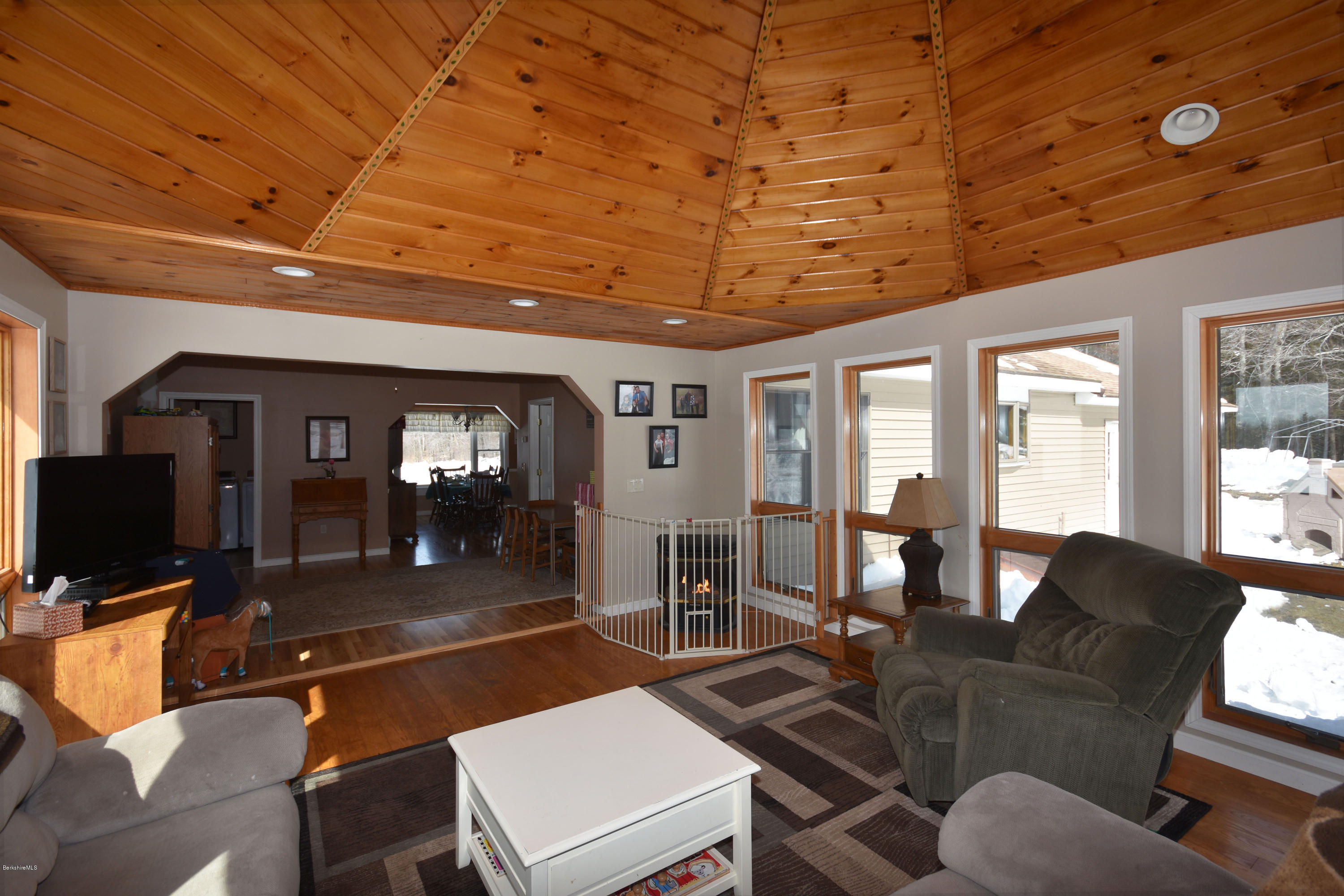 215 Windsor Road Savoy, MA 01256 - Photo 18 of 55 a view of a livingroom with furniture a flat screen tv and windows
