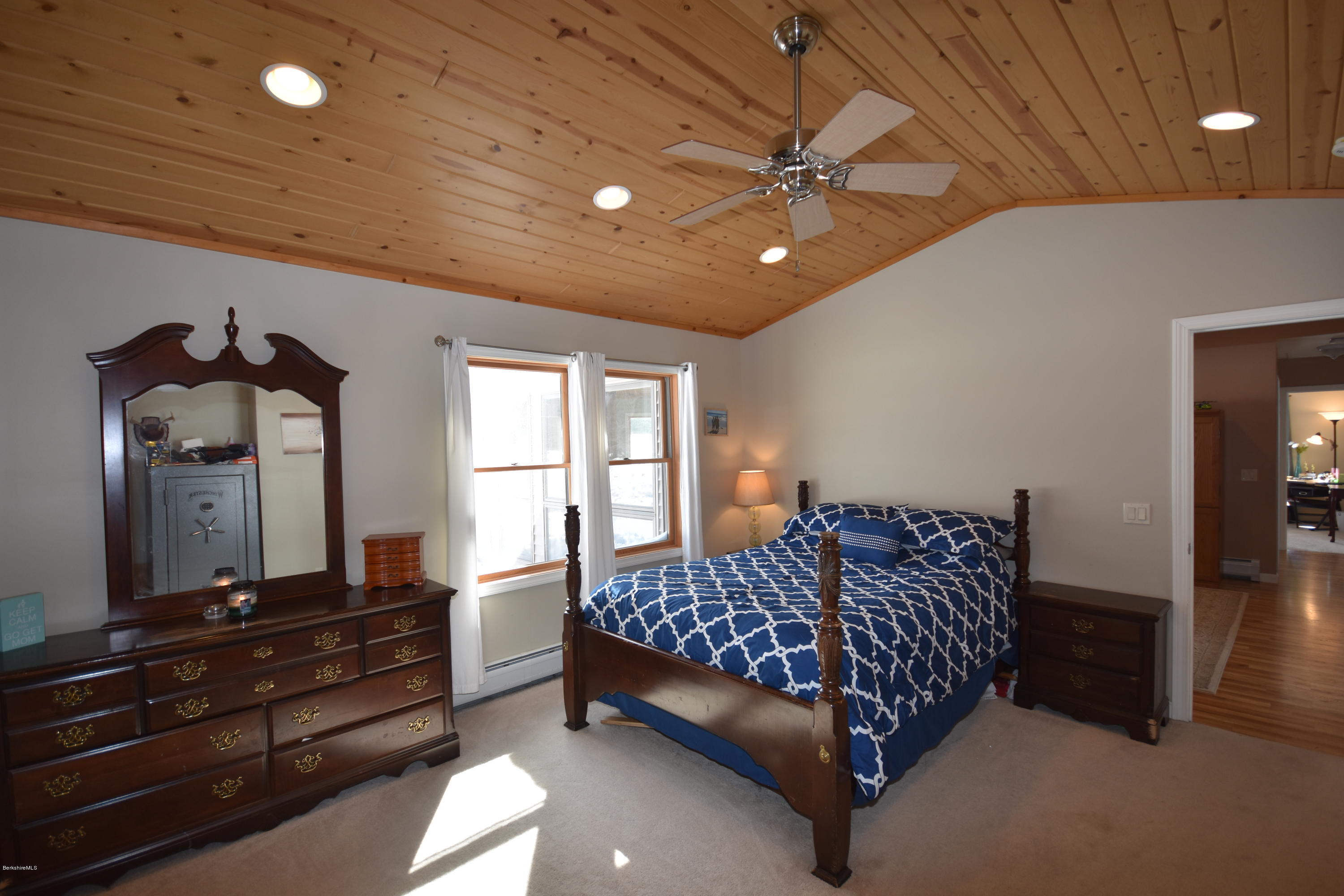 215 Windsor Road Savoy, MA 01256 - Photo 24 of 55 a bed room with a bed and a large mirror