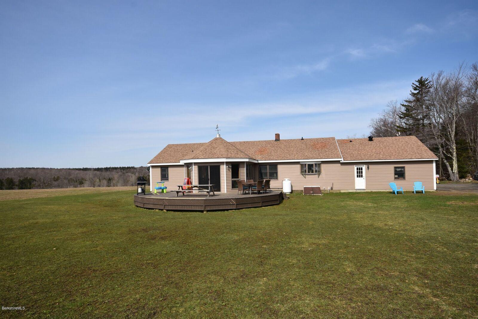 215 Windsor Road Savoy, MA 01256 - Photo 3 of 55 a front view of a house with a garden and yard