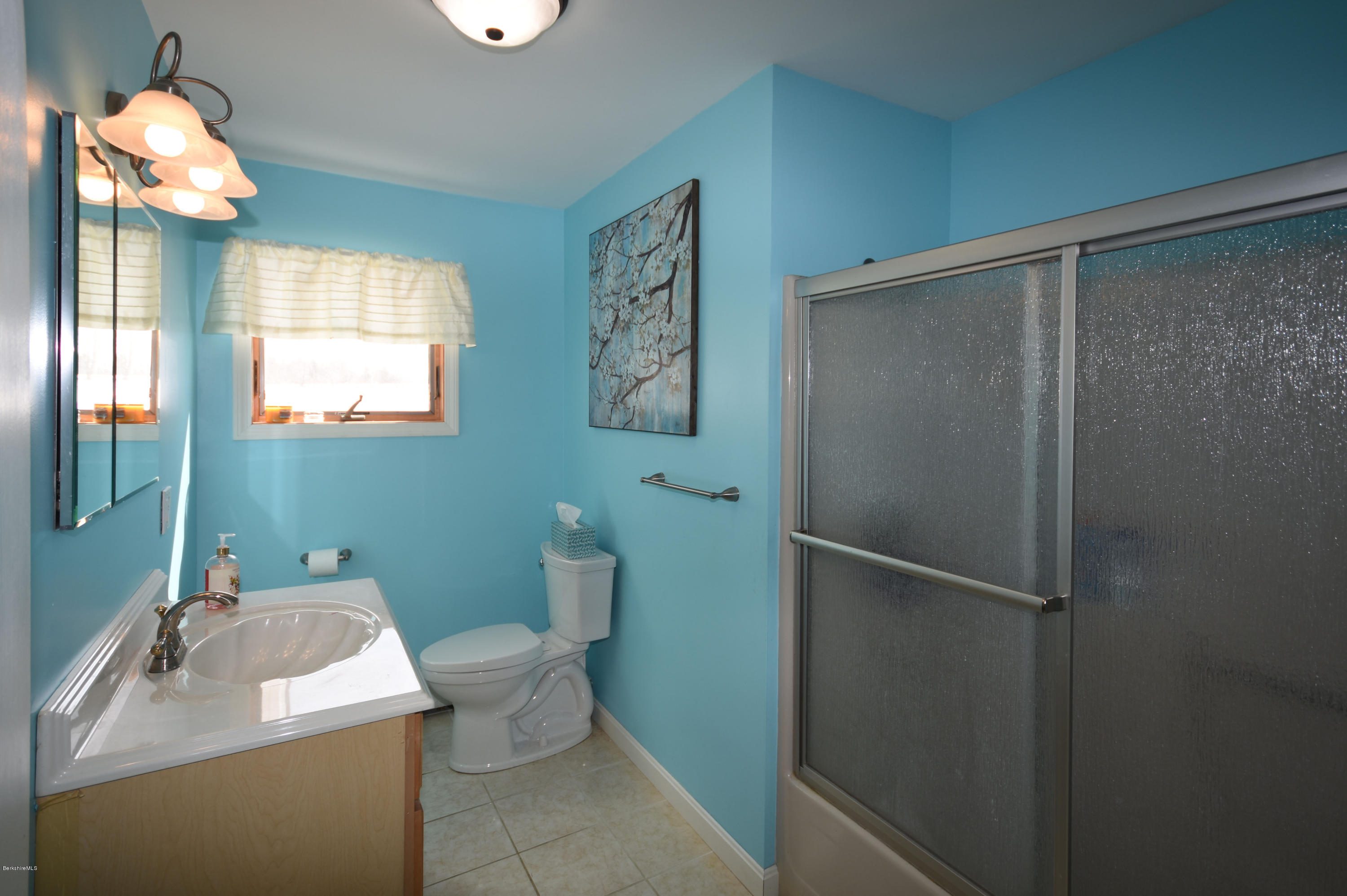 215 Windsor Road Savoy, MA 01256 - Photo 38 of 55 a bathroom with a sink toilet and mirror