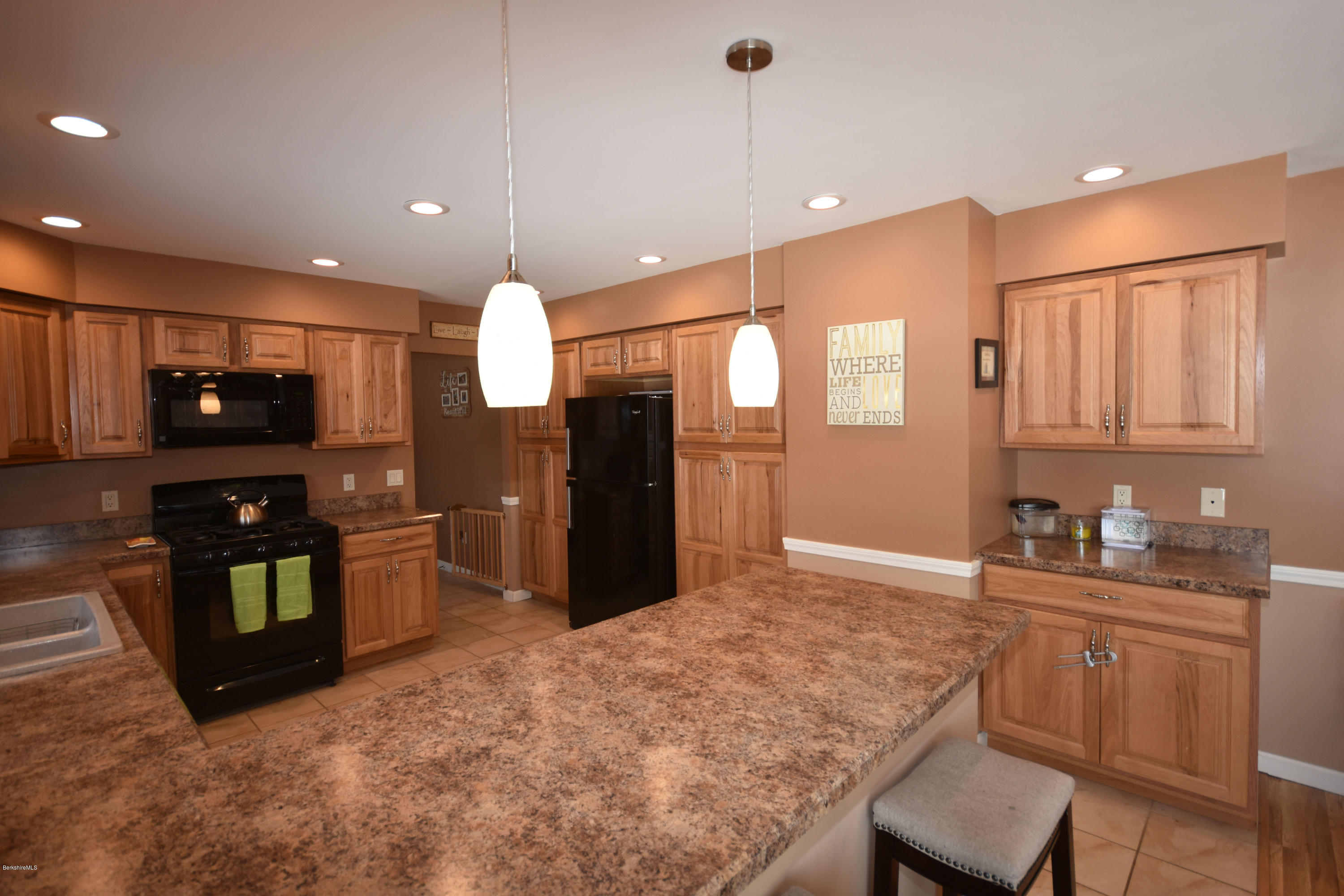 215 Windsor Road Savoy, MA 01256 - Photo 8 of 55 a kitchen with granite countertop a refrigerator and a sink