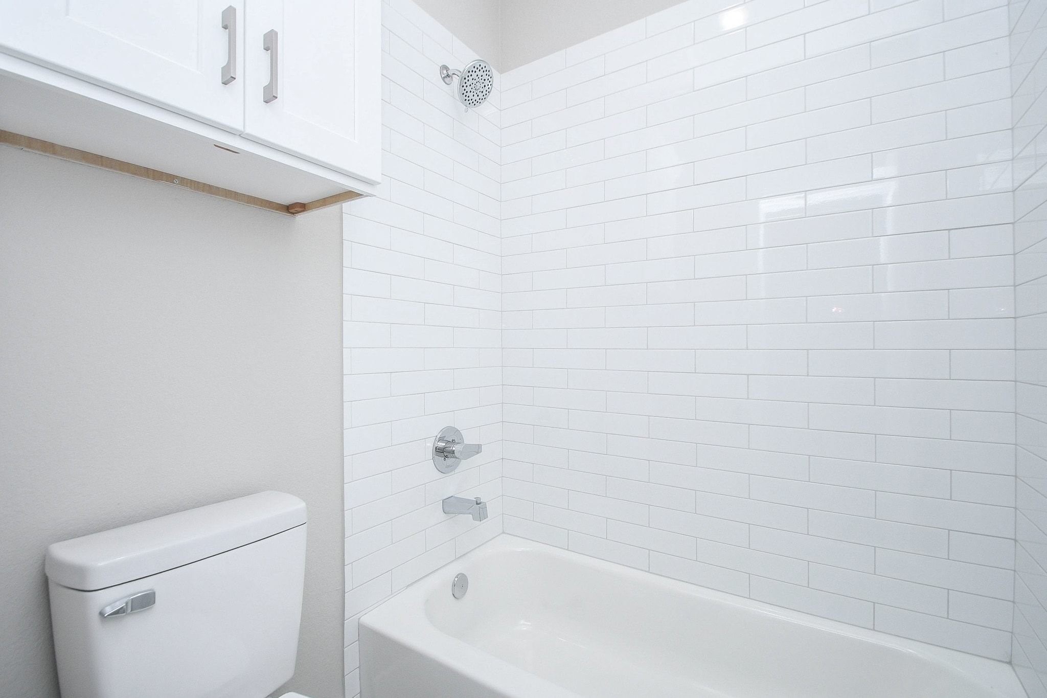 4401 Alvin Street, Unit A Houston, TX 77051 - Photo 14 of 19 a bathroom with a bathtub and a toilet