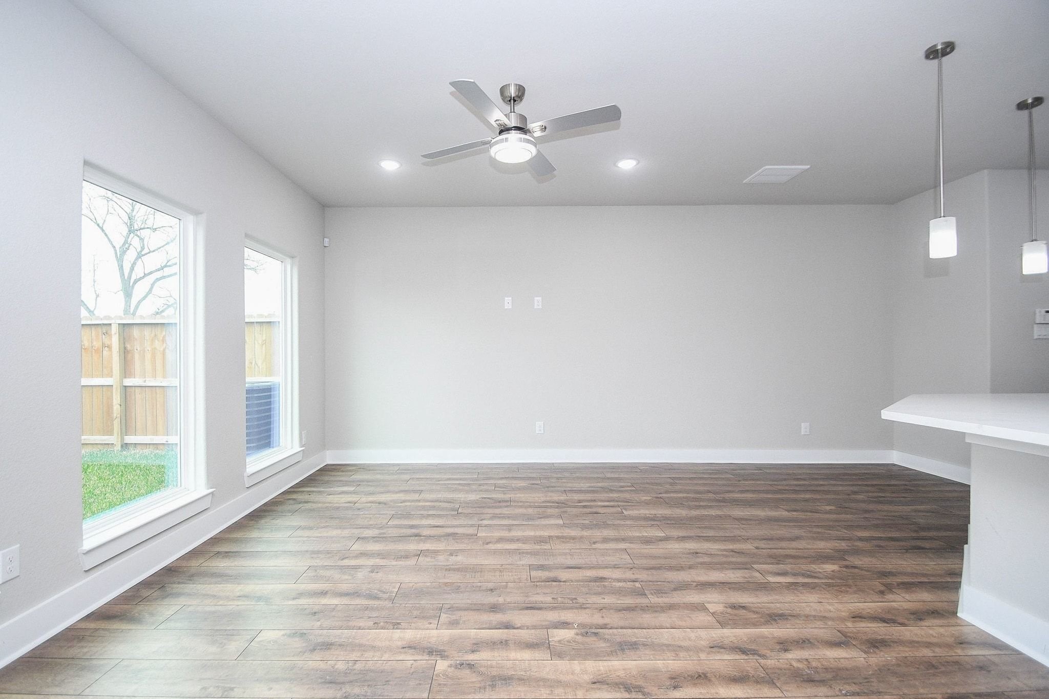 4401 Alvin Street, Unit A Houston, TX 77051 - Photo 17 of 19 a view of an empty room with a window and wooden floor