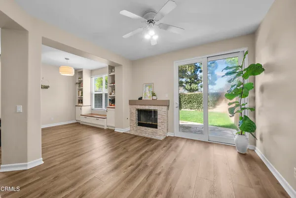 a large kitchen with stainless steel appliances a large counter top and a stove