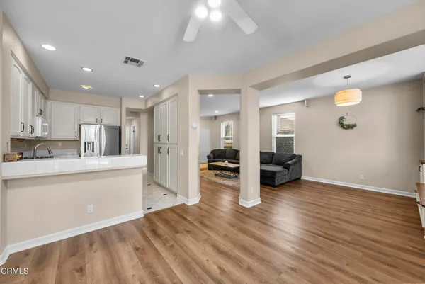 a kitchen with a sink cabinets and appliances