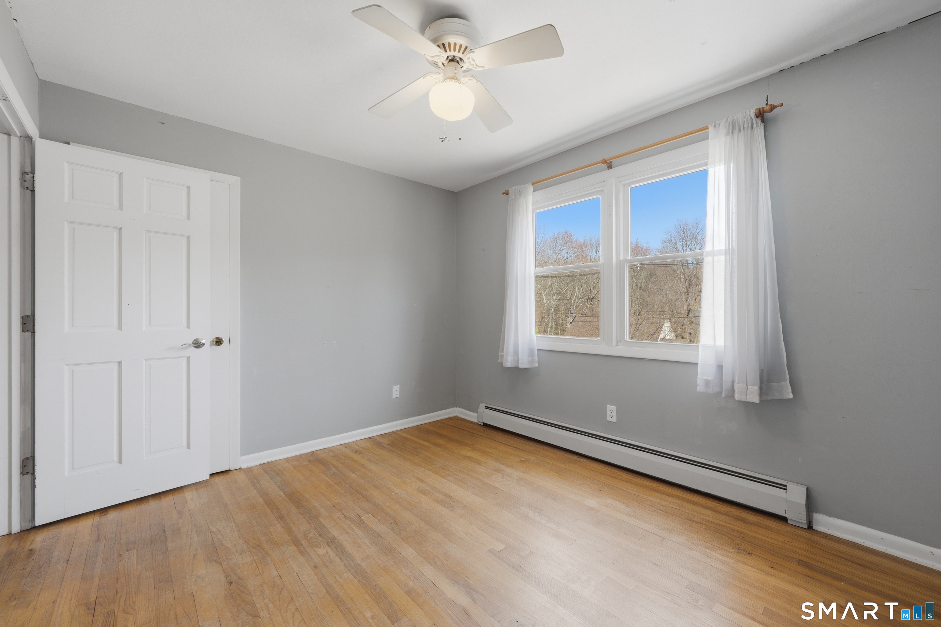 114 Beacon Valley Road Beacon Falls, CT 06403 - Photo 21 of 38 wooden floor in an empty room with a window
