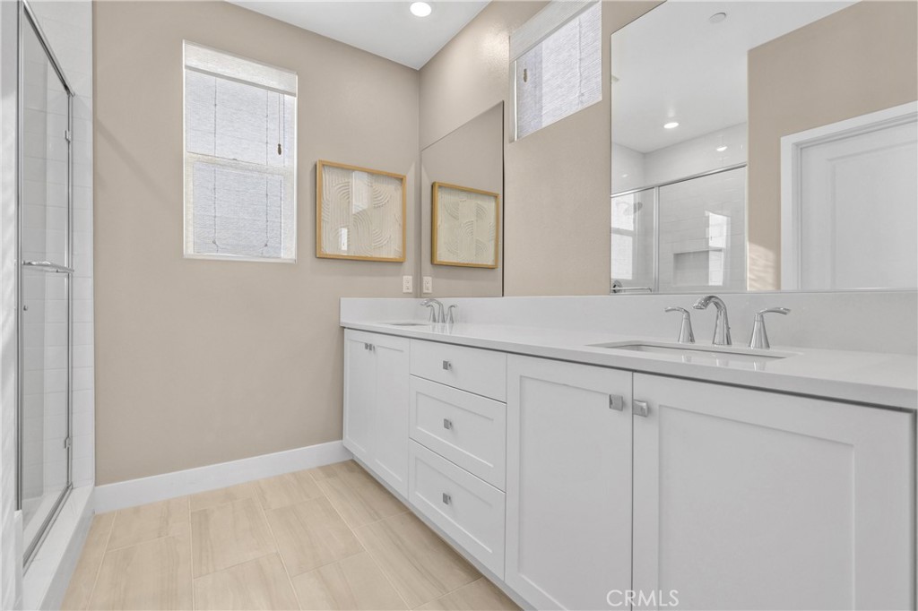 31861 Williams Way Rancho Mission Viejo, CA 92694 - Photo 20 of 28 a bathroom with a double vanity sink and mirror