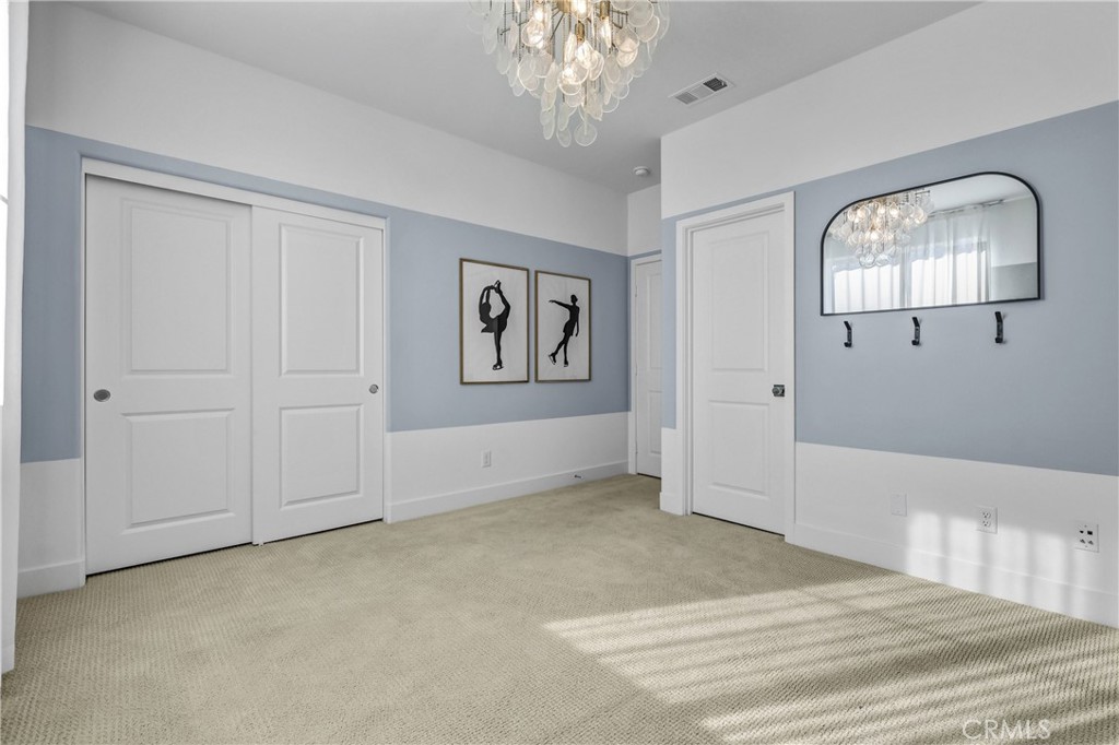 31861 Williams Way Rancho Mission Viejo, CA 92694 - Photo 24 of 28 a view of a livingroom with a chandelier fan and windows