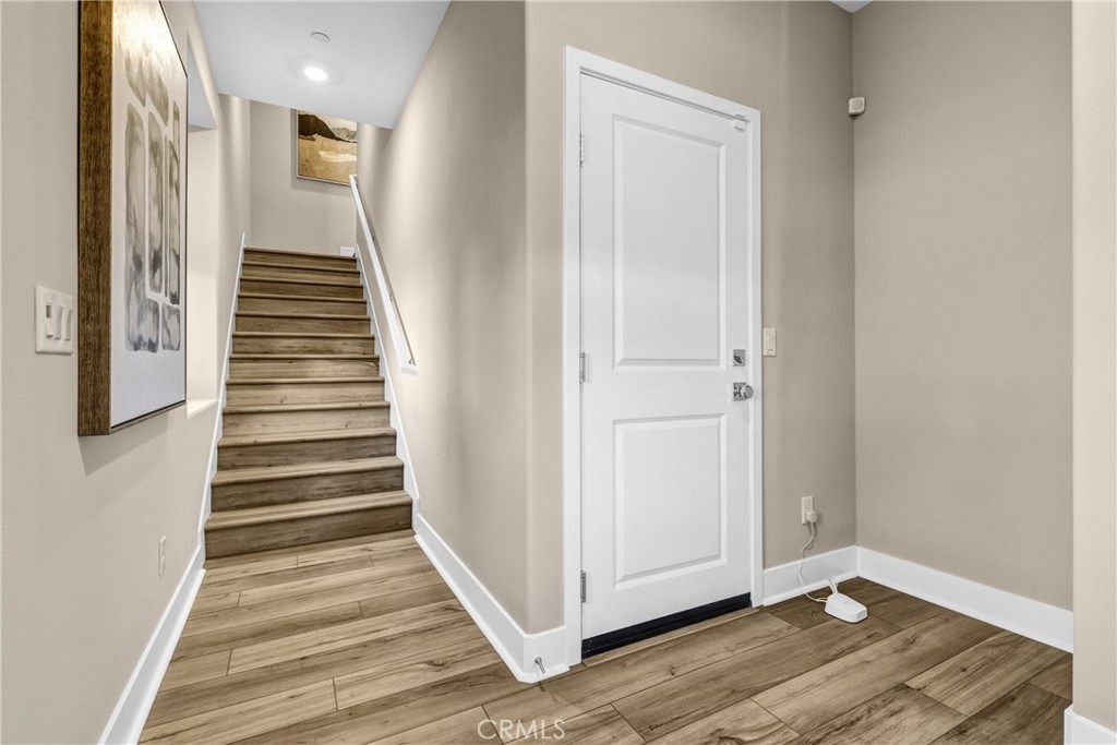 31861 Williams Way Rancho Mission Viejo, CA 92694 - Photo 4 of 28 a view of a hallway with wooden floor and entryway