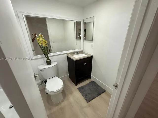 a bathroom with a bathtub a toilet and a shower