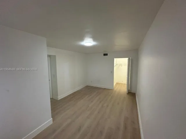 a view of an empty room and window