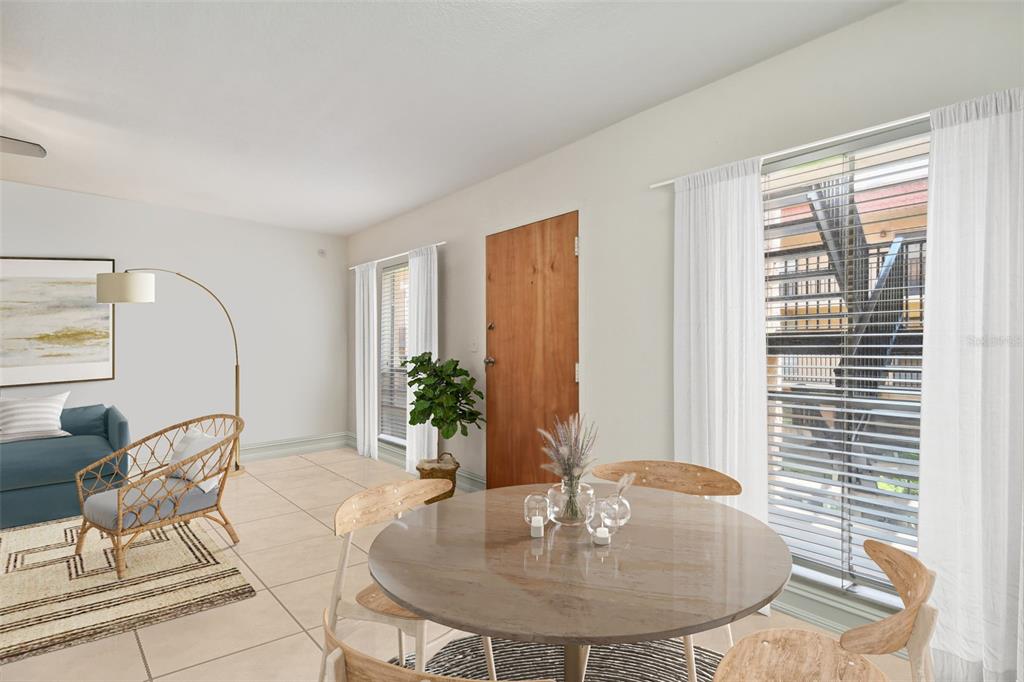 8931 Blind Pass Road, Unit 257 St. Pete Beach, FL 33706 - Photo 4 of 10 a dining room with furniture and wooden floor