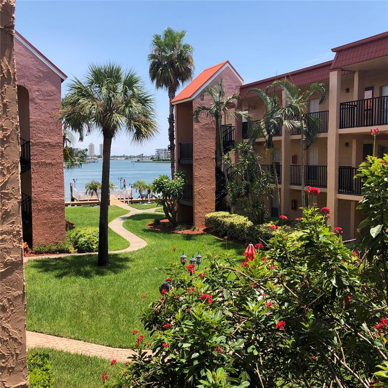 8931 Blind Pass Road, Unit 257 St. Pete Beach, FL 33706 - Photo 8 of 10 front view of a house with a yard