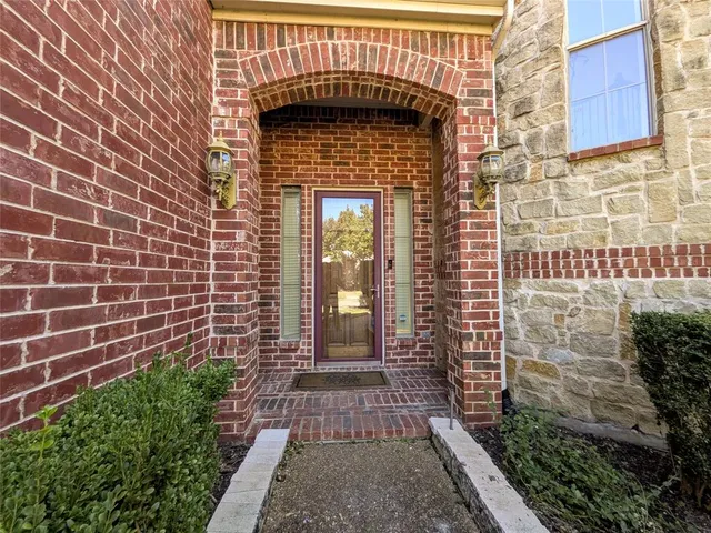 a view of a brick house with a small door