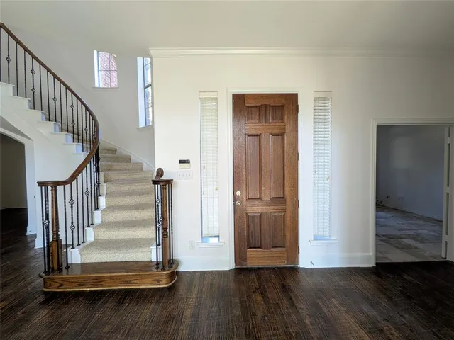 a view of entryway with wooden floor