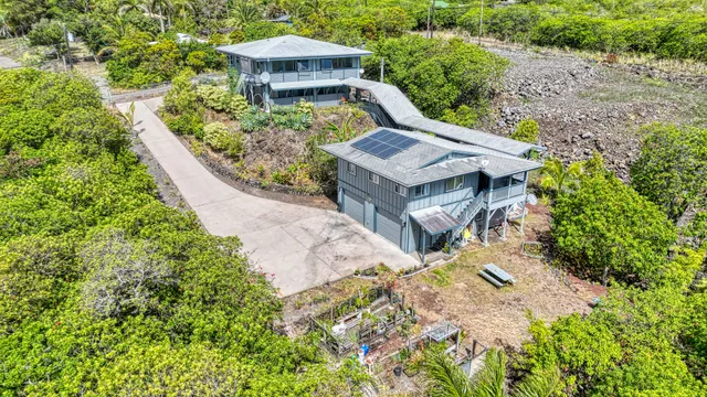 a view of a yard with chairs