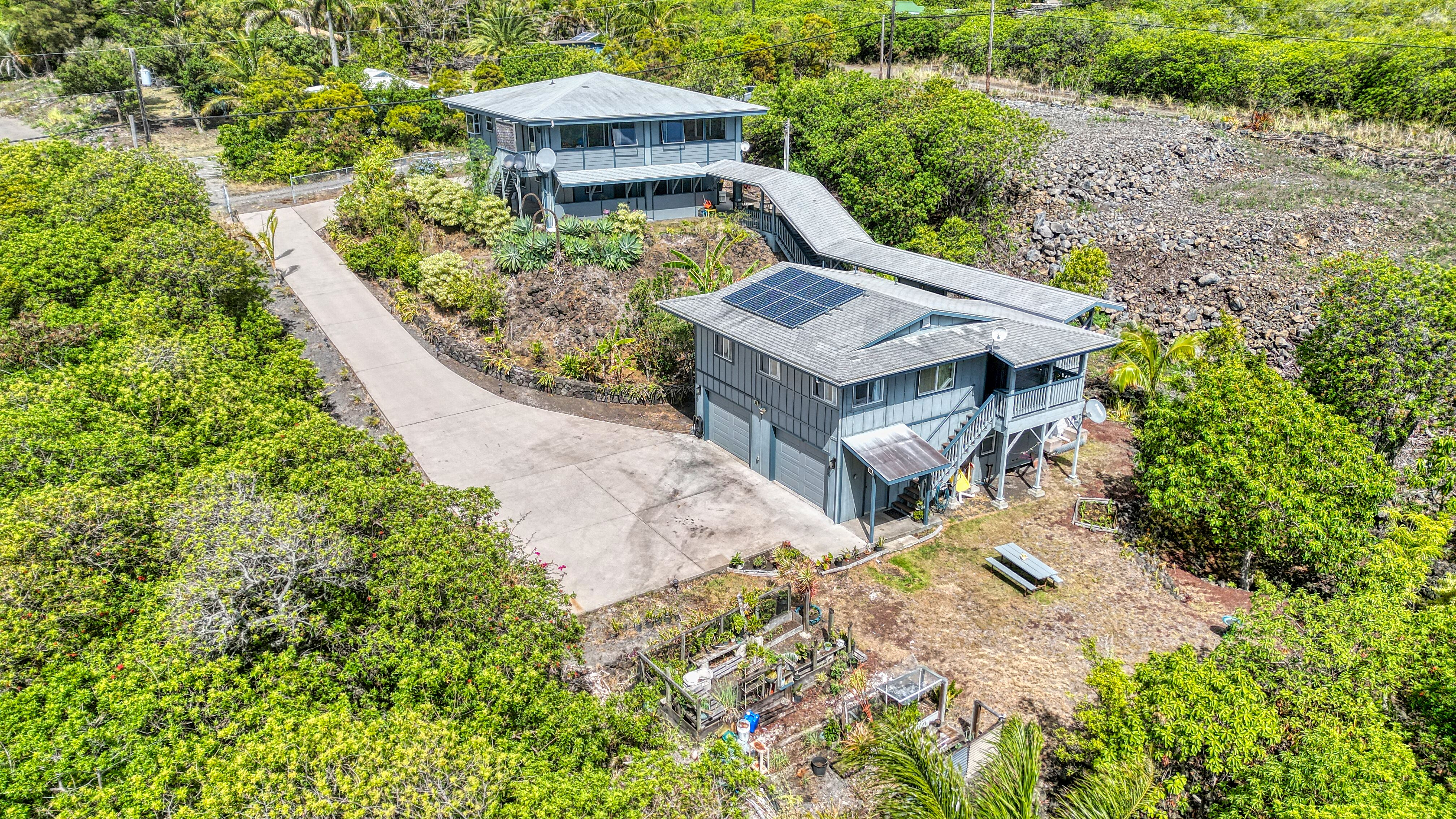 94-1790 Amepela Road Naalehu, HI 96772 - Photo 23 of 30 a view of a yard with chairs
