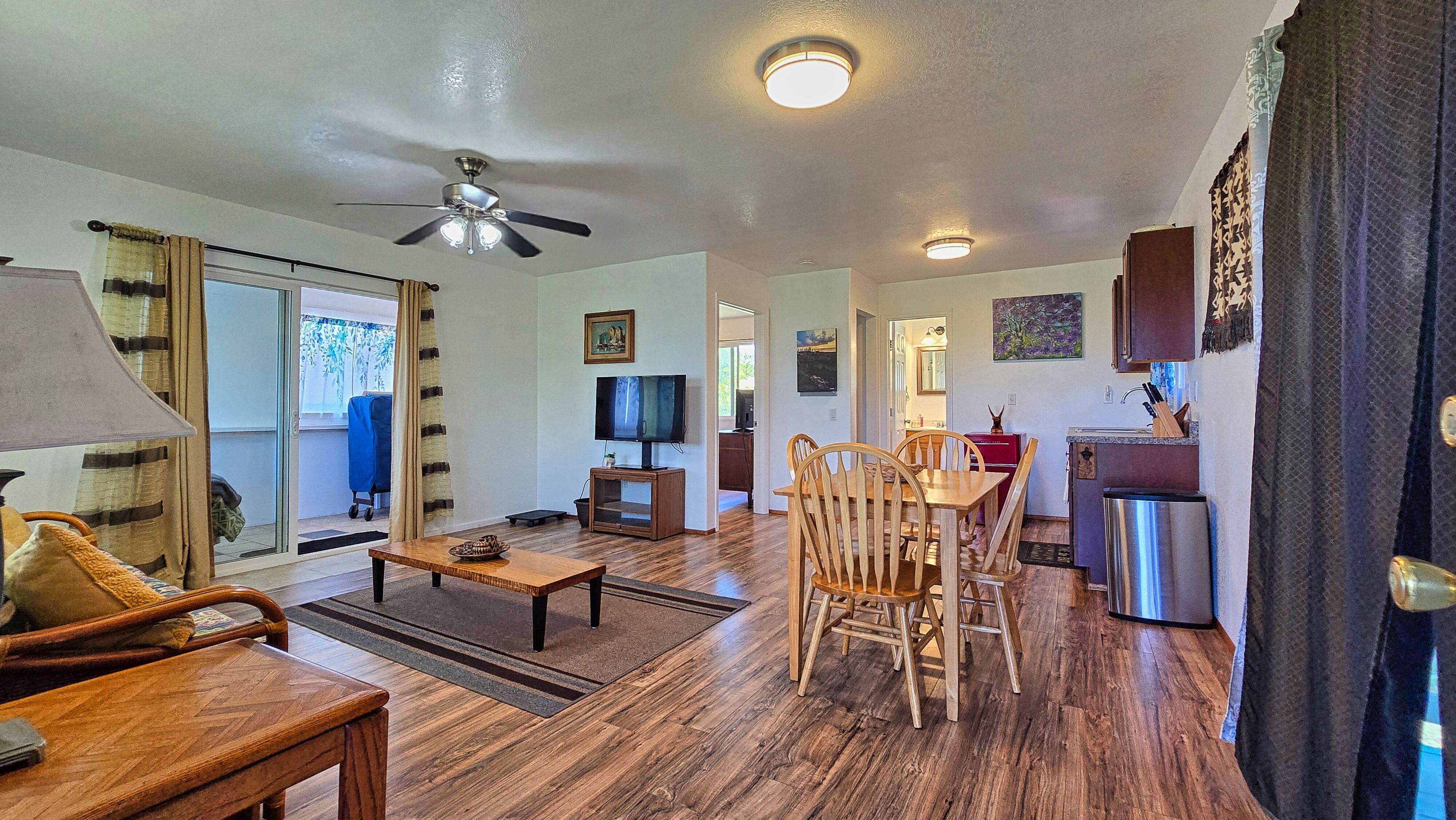 94-1790 Amepela Road Naalehu, HI 96772 - Photo 24 of 30 a living room with furniture and wooden floor