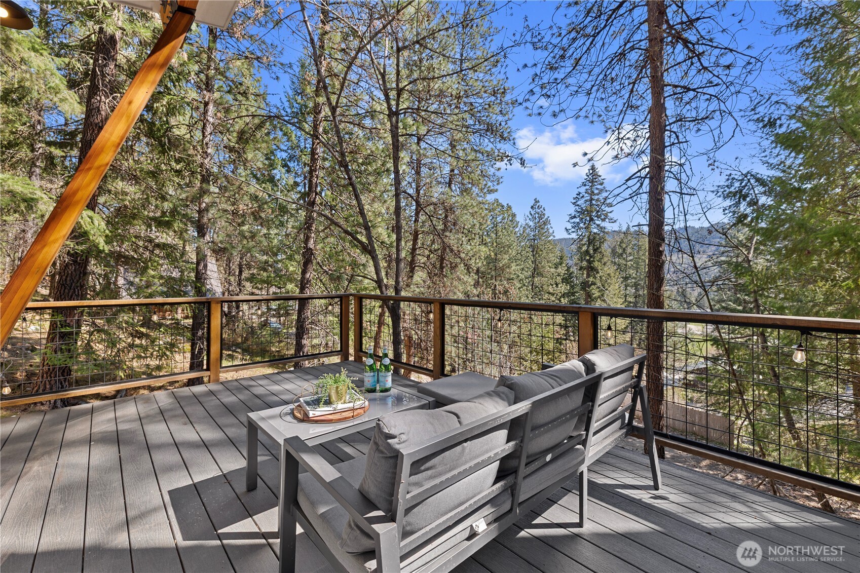 8056 Bayne Road Leavenworth, WA 98826 - Photo 21 of 40 a view of a balcony with wooden floor and outdoor seating