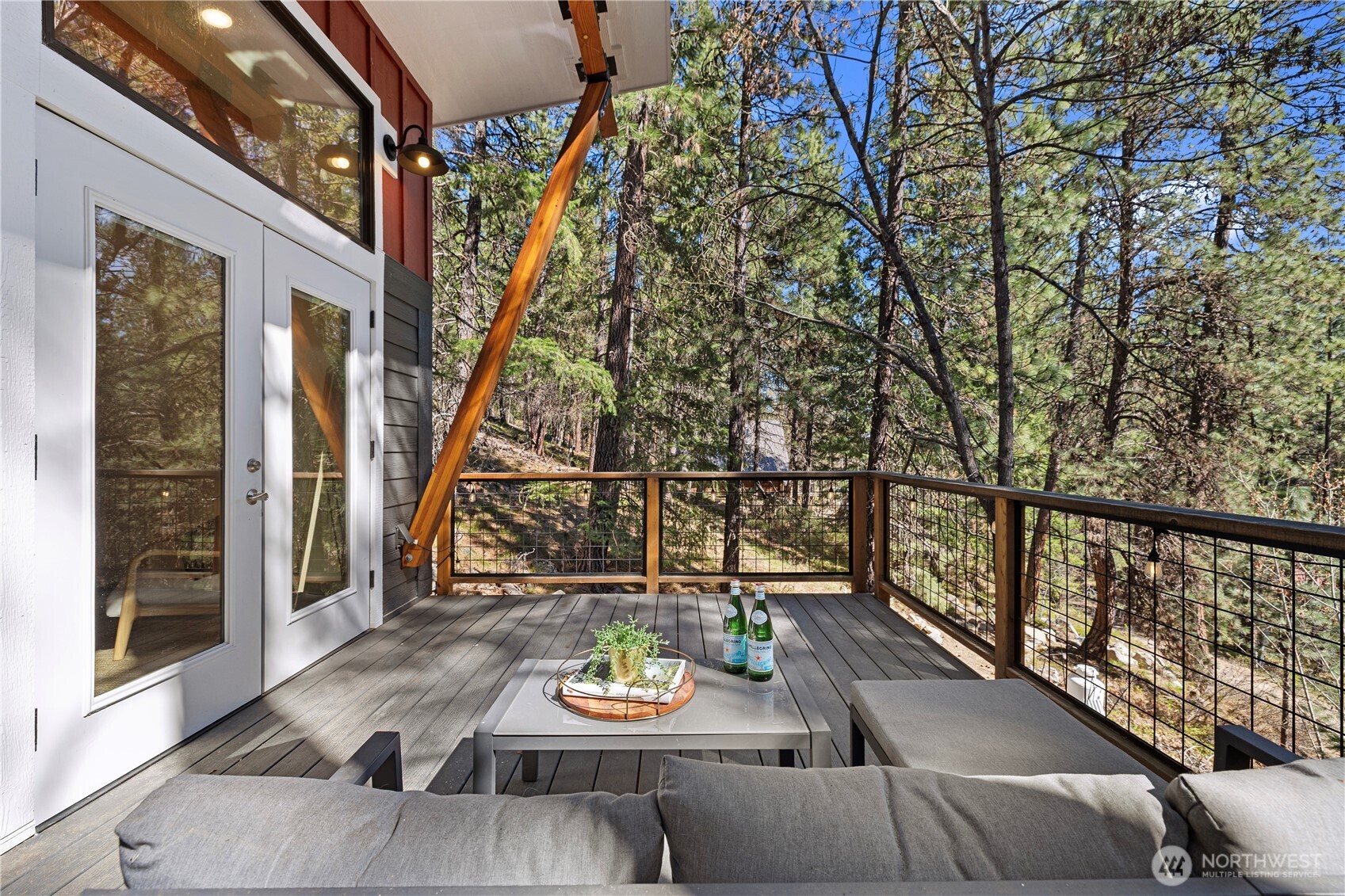 8056 Bayne Road Leavenworth, WA 98826 - Photo 22 of 40 a view of deck with furniture and trees