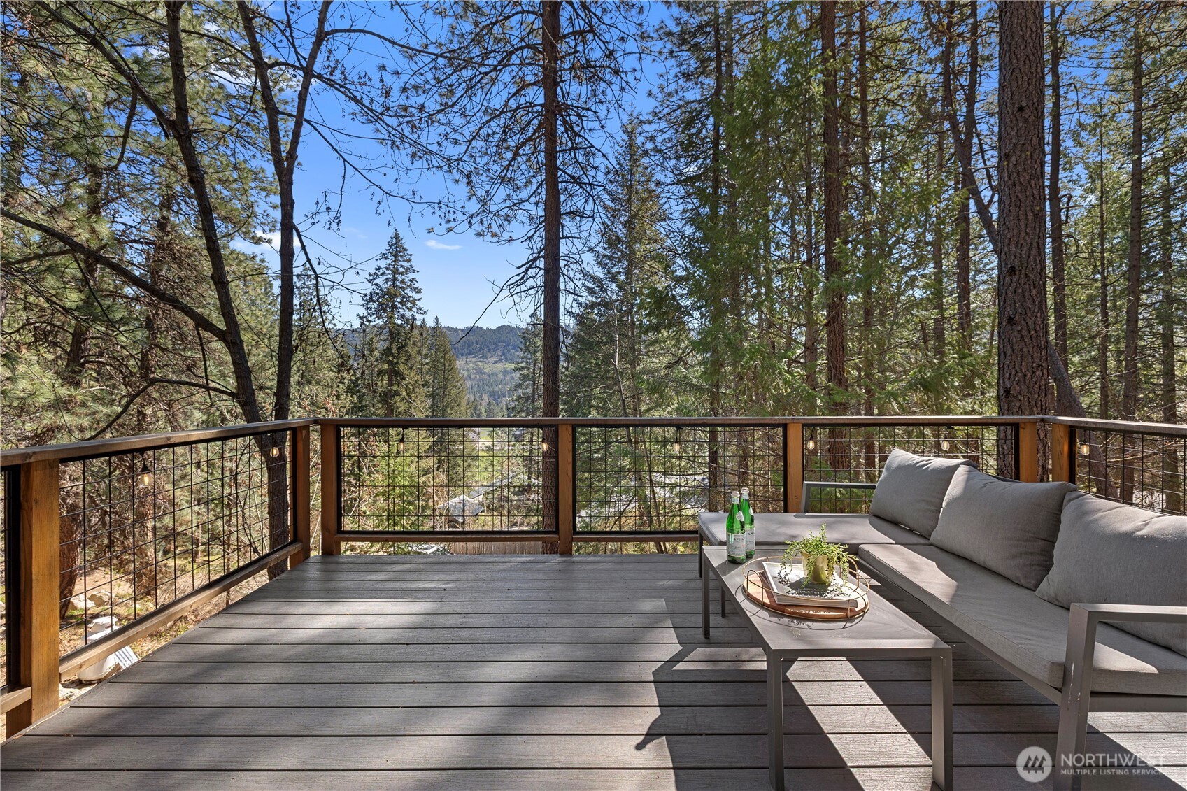 8056 Bayne Road Leavenworth, WA 98826 - Photo 24 of 40 a view of deck with furniture and trees