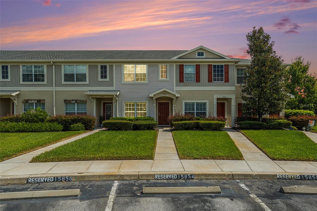 15854 Stable Run Drive Spring Hill, FL 34610 - Photo 27 of 28 a front view of a house with a yard