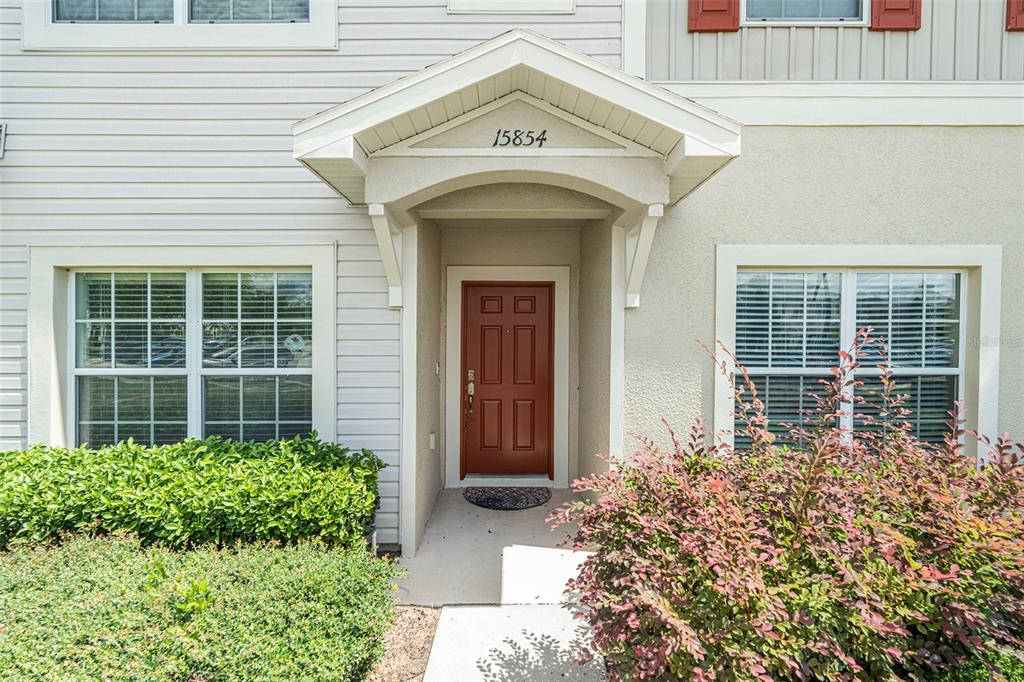 15854 Stable Run Drive Spring Hill, FL 34610 - Photo 3 of 28 a view of a house with potted plants