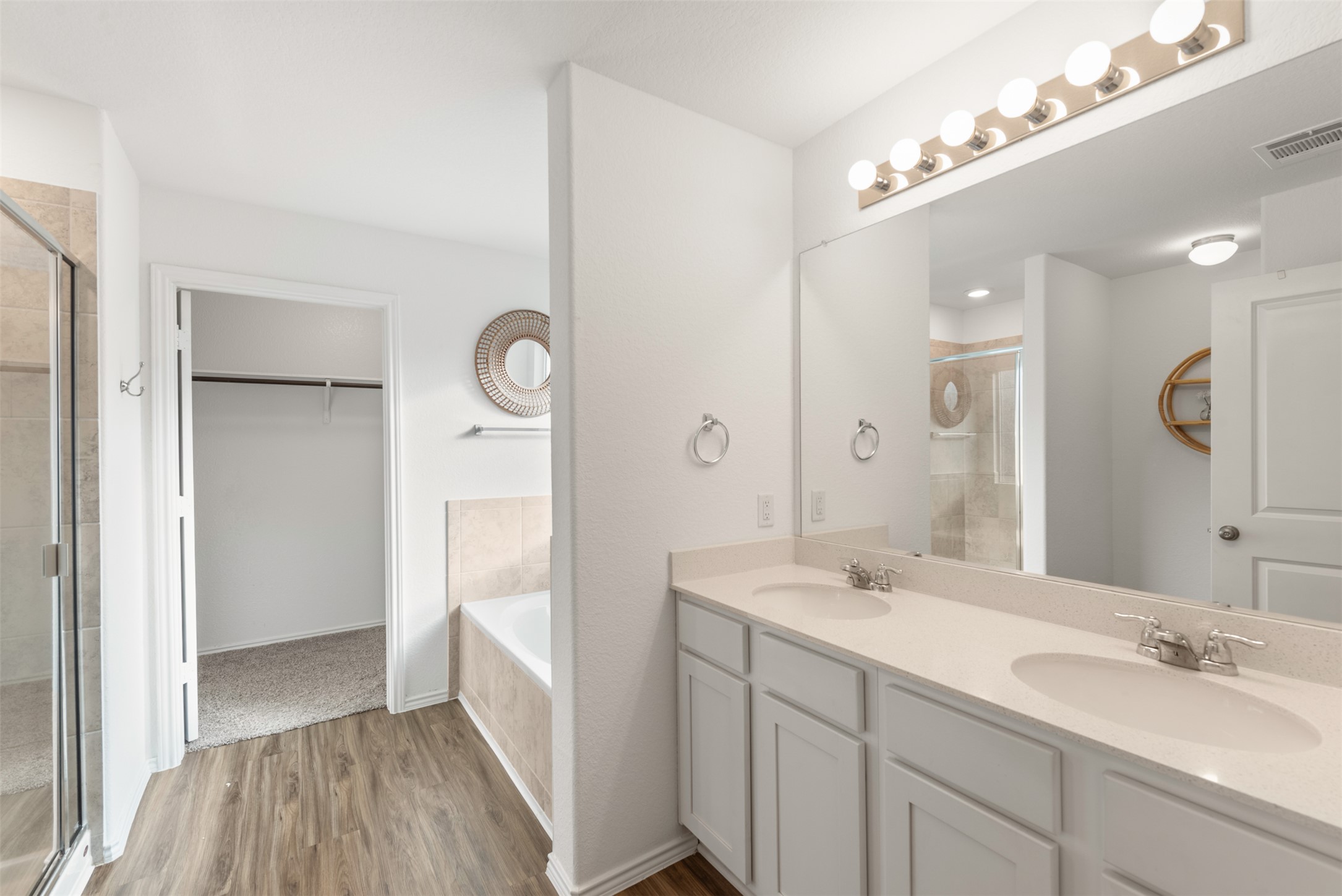230 Crystal River Road Kyle, TX 78640 - Photo 18 of 27 Primary Bathroom including dual-vanities, soaking tub, walk in shower, and a large walk in closet