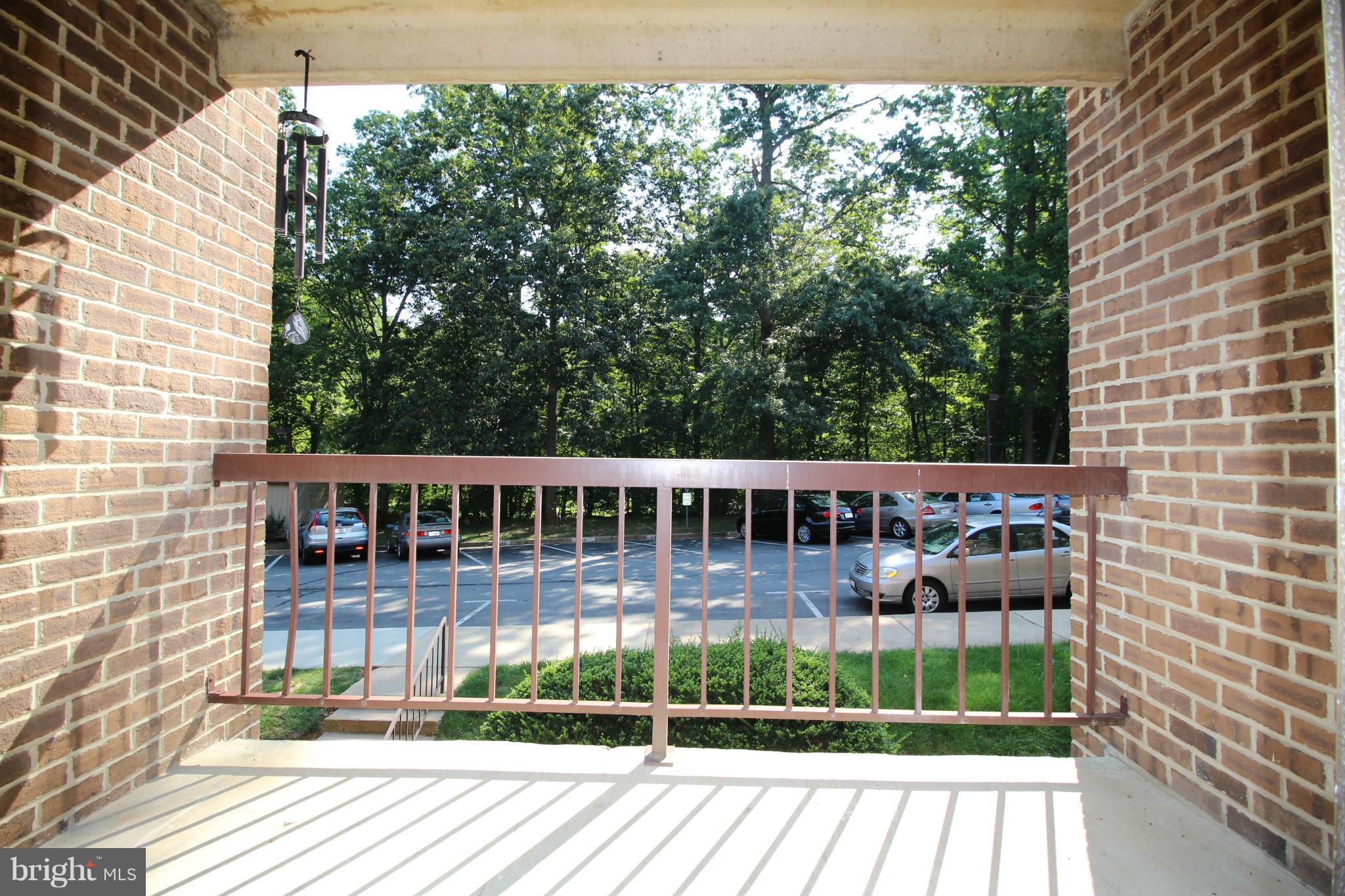 11236 Chestnut Grove Square, Unit 163 Reston, VA 20190 - Photo 2 of 4 Balcony that backs to trees and basketball/tennis