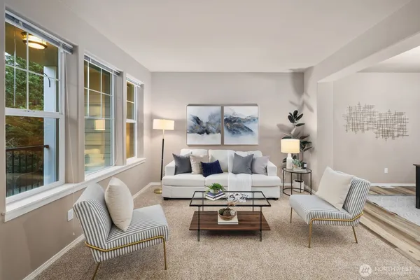 a living room with furniture and a large window