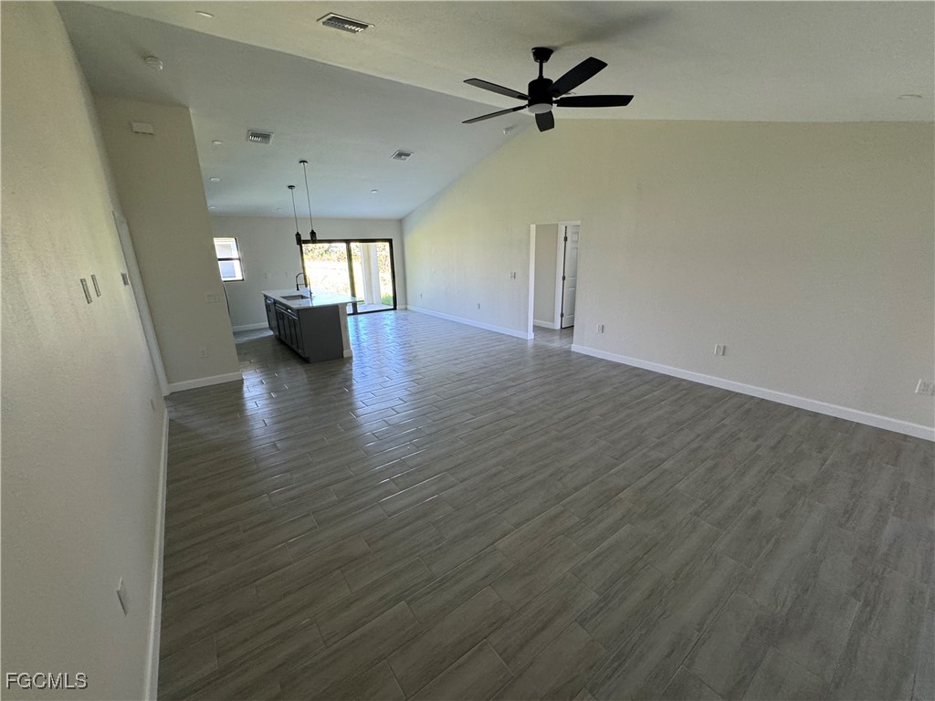 6108 Holt Court Fort Myers, FL 33905 - Photo 15 of 19 wooden floor in an empty room with a window