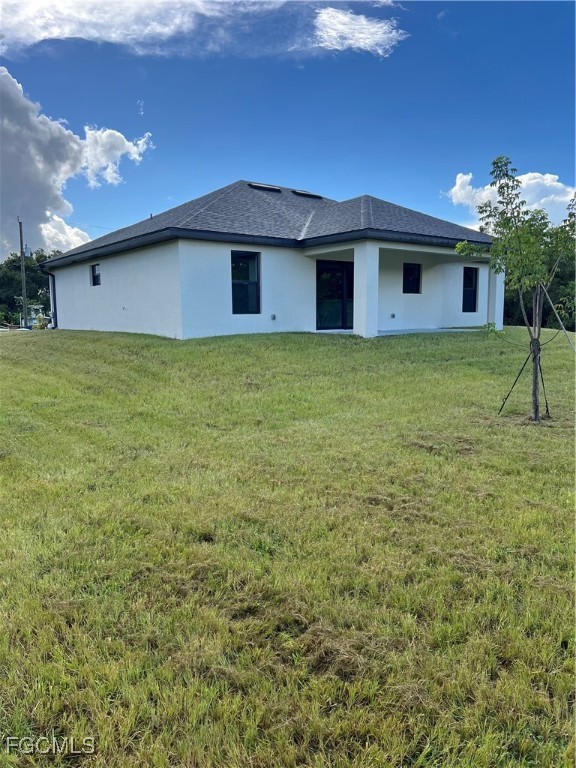 6108 Holt Court Fort Myers, FL 33905 - Photo 2 of 19 a front view of a house with a yard